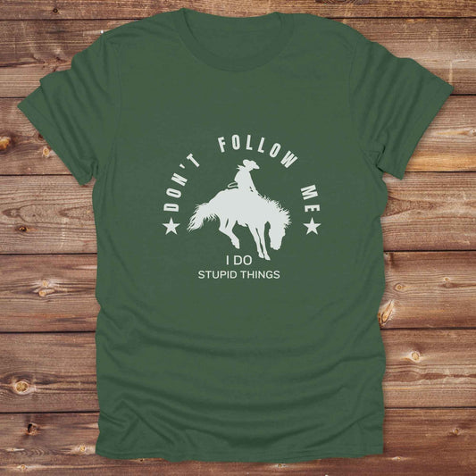Fun western t-shirt for horse lovers and cowgirls. Western cowgirl graphic tee with horse design. Cowboy humor t-shirt for rodeo and country lovers. Horse lover funny t-shirt with western theme. Country style horse graphic tee for cowboys and cowgirls. Retro style funny western shirt for equestrians. Cute and funny country shirt with horse print. Southern cowgirl funny quote shirt for horse lovers. Dont follow me I do stupid things.