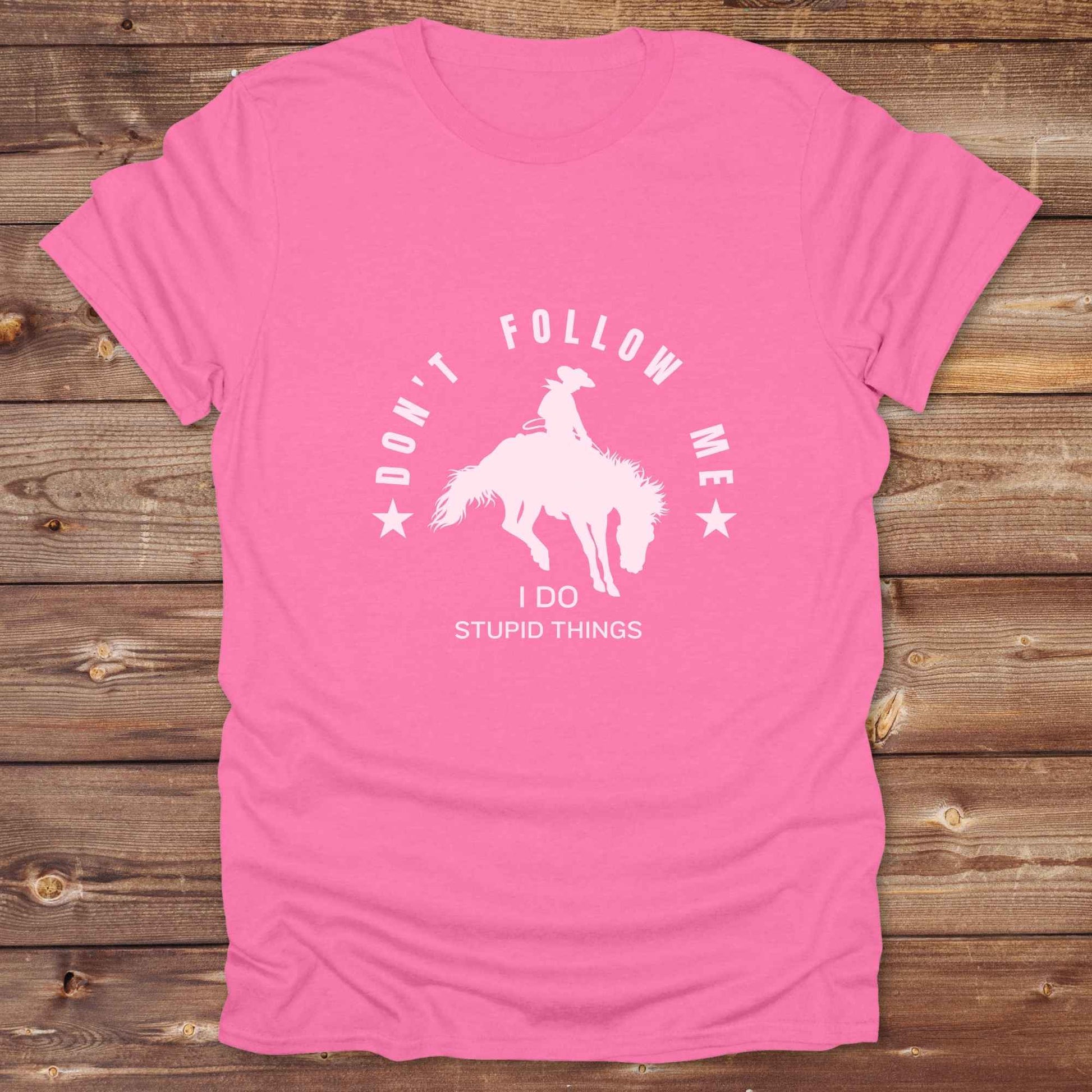 Fun western t-shirt for horse lovers and cowgirls. Western cowgirl graphic tee with horse design. Cowboy humor t-shirt for rodeo and country lovers. Horse lover funny t-shirt with western theme. Country style horse graphic tee for cowboys and cowgirls. Retro style funny western shirt for equestrians. Cute and funny country shirt with horse print. Southern cowgirl funny quote shirt for horse lovers. Dont follow me I do stupid things.