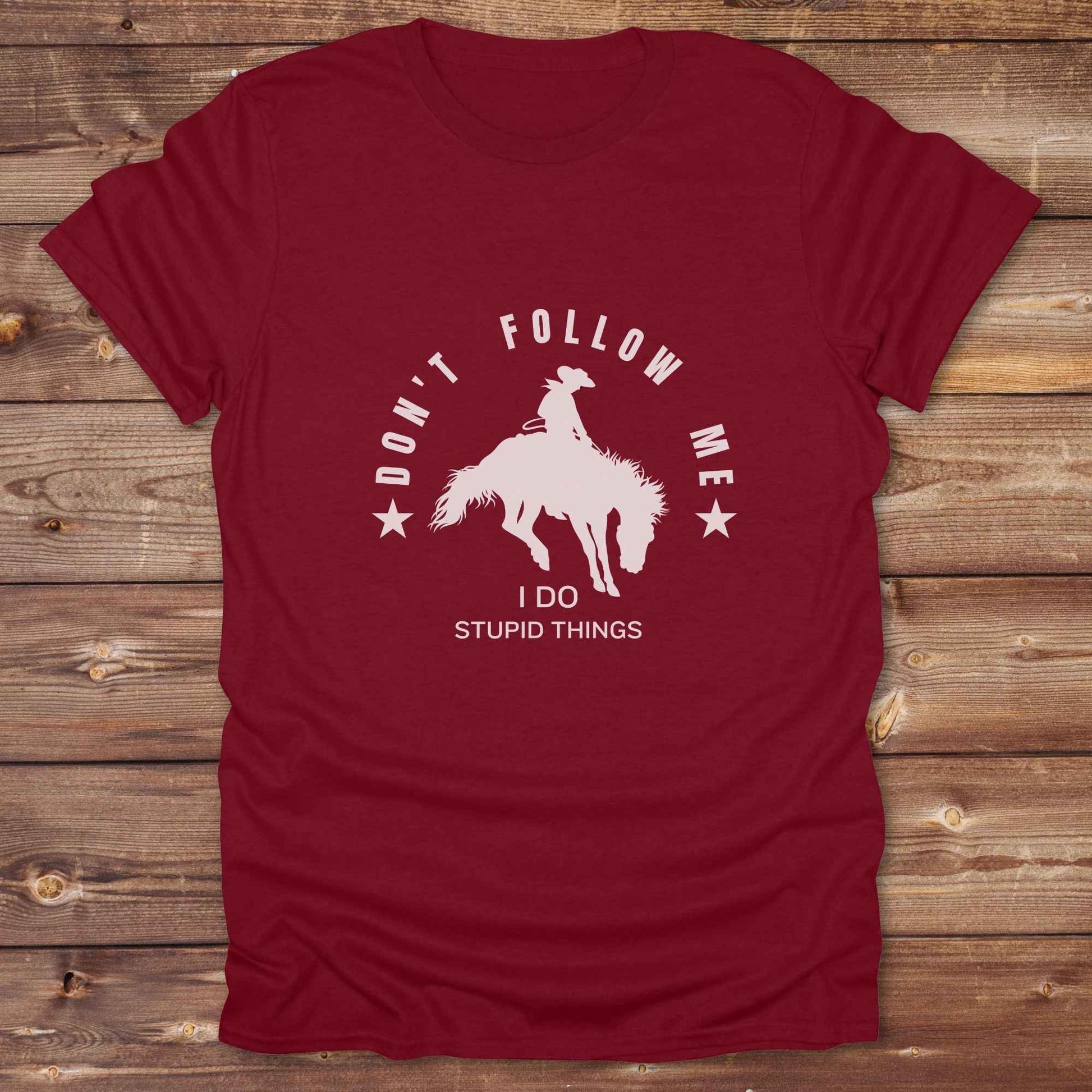 Fun western t-shirt for horse lovers and cowgirls. Western cowgirl graphic tee with horse design. Cowboy humor t-shirt for rodeo and country lovers. Horse lover funny t-shirt with western theme. Country style horse graphic tee for cowboys and cowgirls. Retro style funny western shirt for equestrians. Cute and funny country shirt with horse print. Southern cowgirl funny quote shirt for horse lovers. Dont follow me I do stupid things.