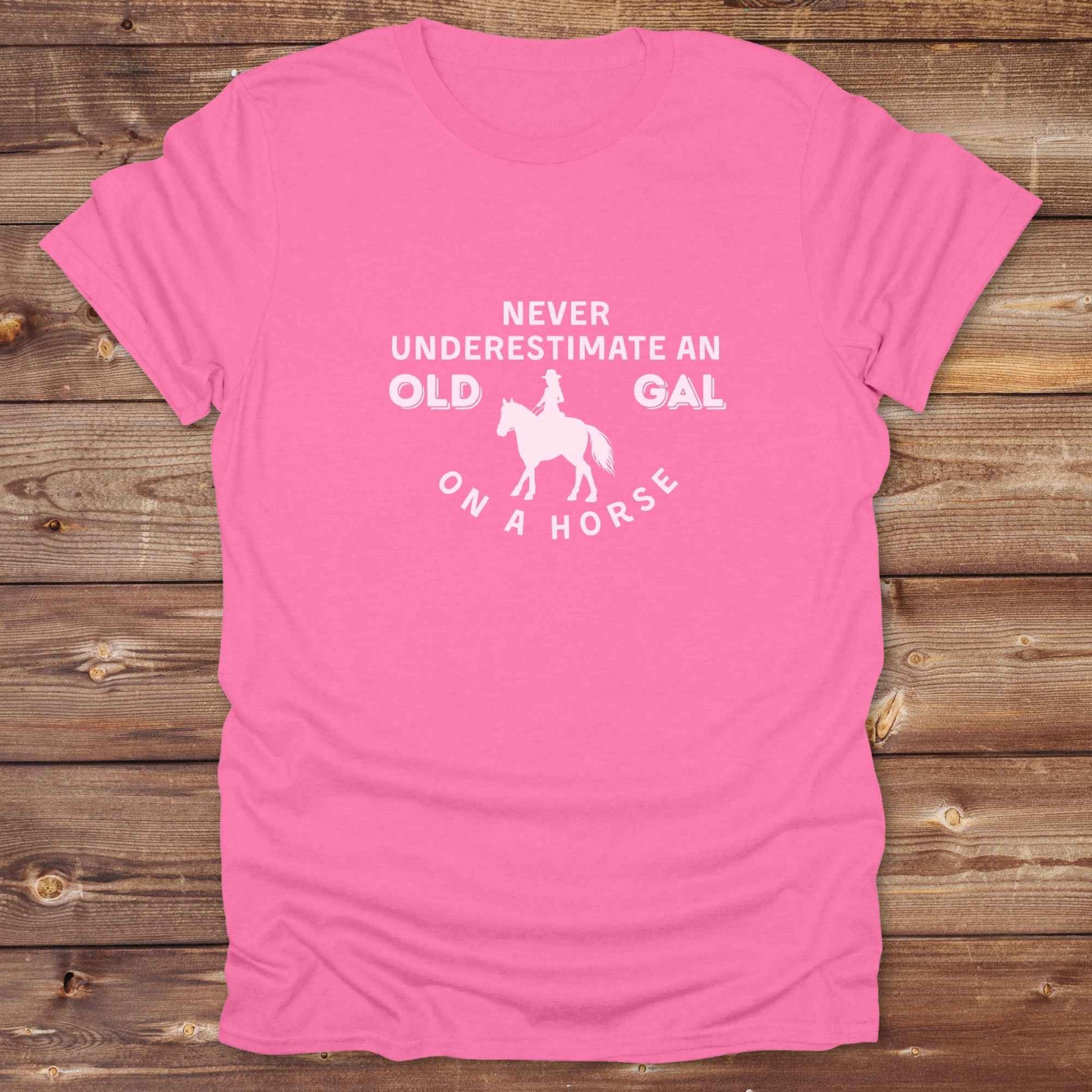 Fun western t-shirt for horse lovers and cowgirls. Western cowgirl graphic tee with horse design. Cowboy humor t-shirt for rodeo and country lovers. Horse lover funny t-shirt with western theme. Country style horse graphic tee for cowboys and cowgirls. Retro style funny western shirt for equestrians. Cute and funny country shirt with horse print. Southern cowgirl funny quote shirt for horse lovers. Never underestimate an old gal on a horse.