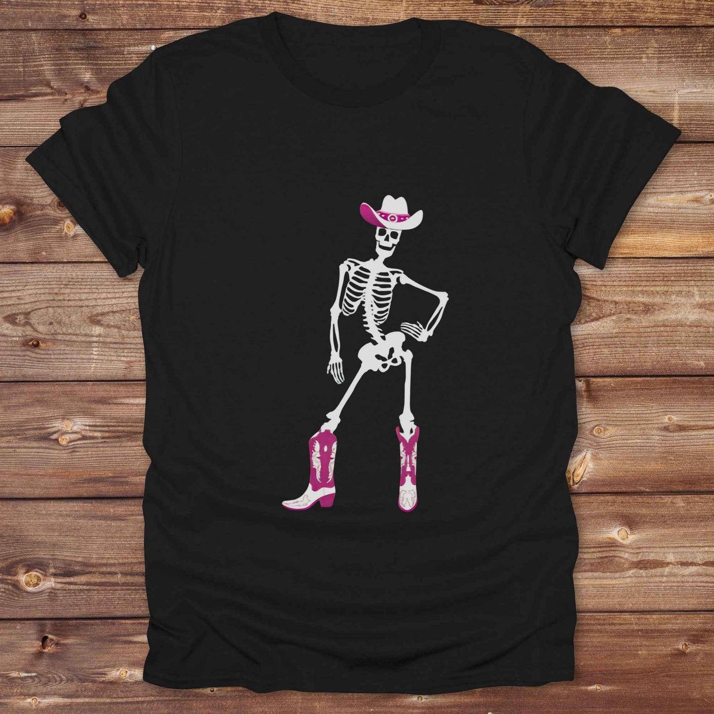 Cowgirl Skeleton T-Shirt is your ultimate spooky-season western tee — perfect for cowgirls, rodeo lovers, and horse fans who want to stand out. Featuring a bold white skeleton in cowboy boots and hat, it’s got that wild west attitude with Halloween sass. For gifting a country girl or dressing for a western Halloween, this tee turns heads and boots up sales. Great for cowgirl birthdays, rodeo fans, and those with spooky southern charm.