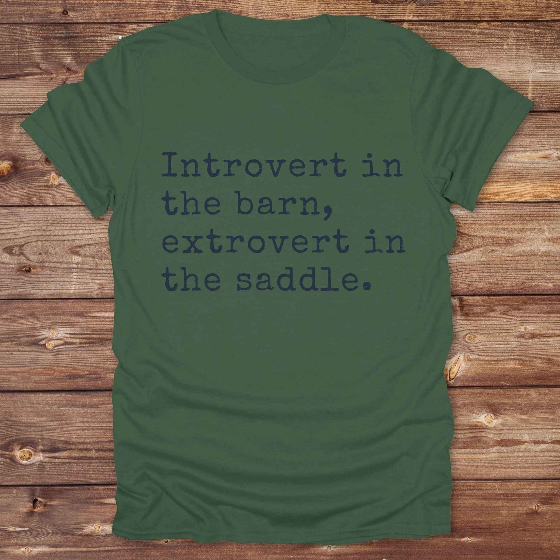 “Introvert in the Barn, Extrovert in the Saddle” t-shirt is the ultimate tee for horse lovers, cowgirls, and western introverts. Whether you're quietly mucking stalls or stealing the show in the arena. made for equestrian souls who ride louder than they talk. Designed with comfort in mind, this western quote shirt is perfect for rodeo nights, barn hangs, or gifting a fellow horse girl.