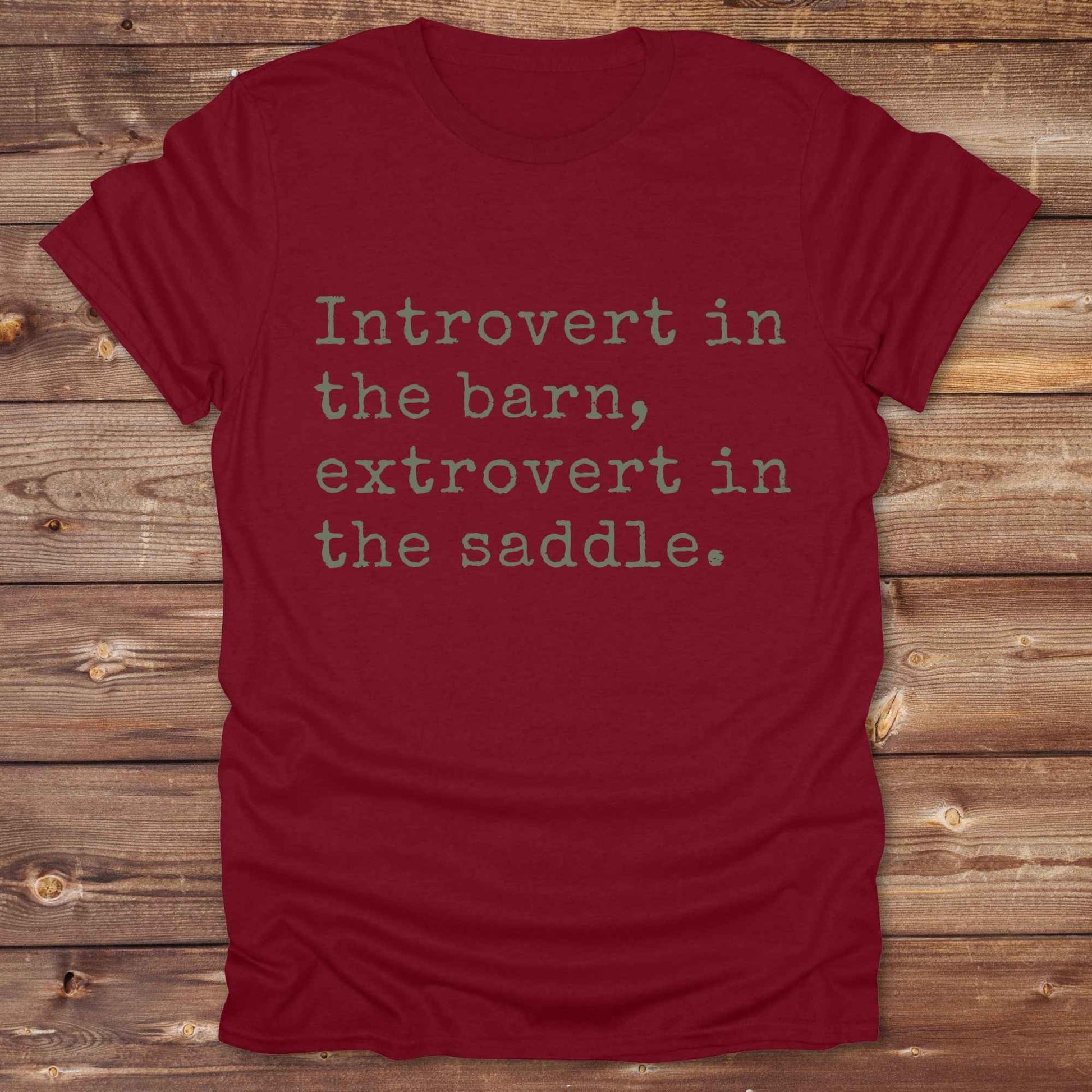 “Introvert in the Barn, Extrovert in the Saddle” t-shirt is the ultimate tee for horse lovers, cowgirls, and western introverts. Whether you're quietly mucking stalls or stealing the show in the arena. made for equestrian souls who ride louder than they talk. Designed with comfort in mind, this western quote shirt is perfect for rodeo nights, barn hangs, or gifting a fellow horse girl.