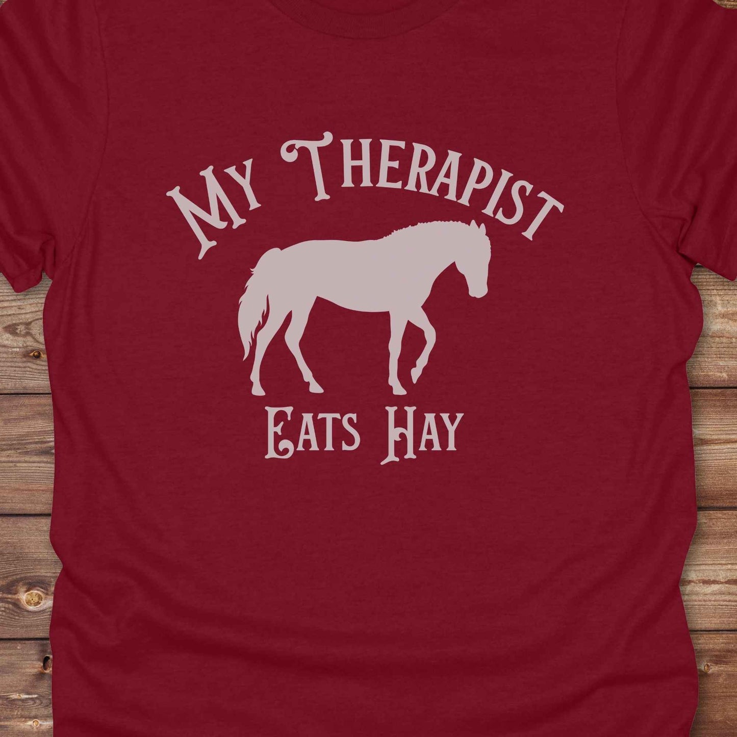 “My Therapist Eats Hay” t-shirt is the perfect mix of humor and horse lover pride, made for cowgirls, cowboys, and western enthusiasts alike. Featuring a bold horse silhouette and vintage western font, it’s ideal for barn days, rodeo nights, or gifting to someone who finds peace in the pasture. Great for birthdays, country events, or just repping your equine therapist with style. Whether you ride for fun or sanity, this western tee keeps the cowboy spirit alive with every wear.