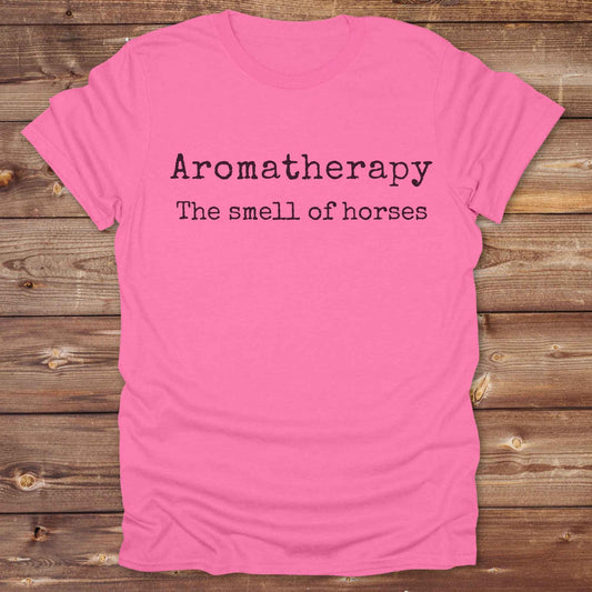 This "Aromatherapy: The Smell of Horses" t-shirt is perfect for cowgirls, horse moms, and equestrian fans who adore the unmistakable barn scent of saddles, hay, and horses. Designed with rustic charm and equine humor, it makes an ideal gift for western lifestyle lovers, riders, or anyone who finds peace in the smell of a stable. Whether it’s for rodeos, barn events, or lounging in the pasture, this tee says what every true horse lover knows.