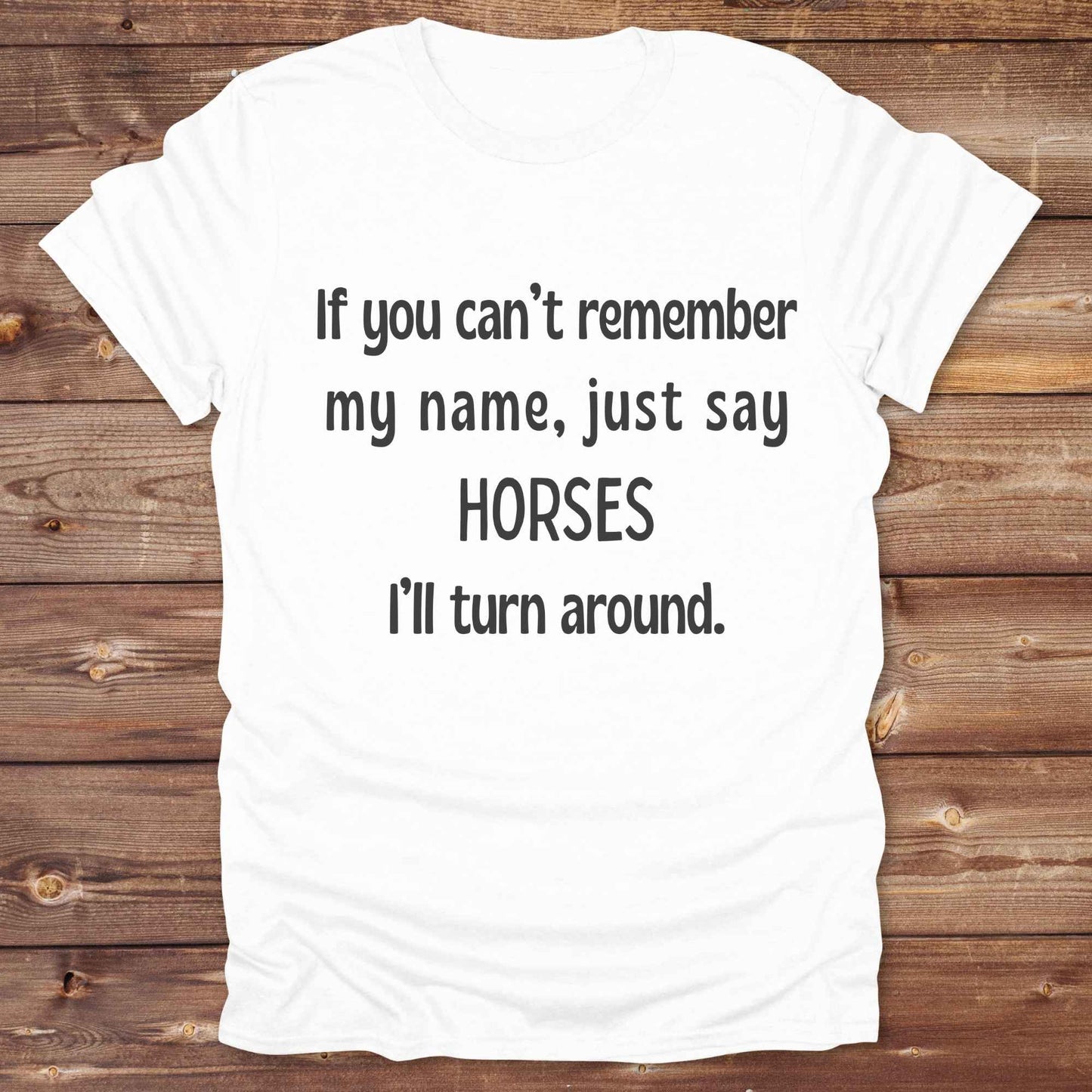 Get noticed with our hilarious “If You Can’t Remember My Name, Shout Horses” t-shirt designed for cowgirls, cowboys, and horse lovers who live for western humor and barn life. This bold, rustic graphic tee is a perfect gift for birthdays, rodeo events, or just showing off your horse obsession. Made for comfort and laughs, it's the ideal shirt for stables, trail rides, and every country concert. Cowgirl up and shout your style loud and proud. From rustic charm to rodeo ready sass, this shirt says it all!