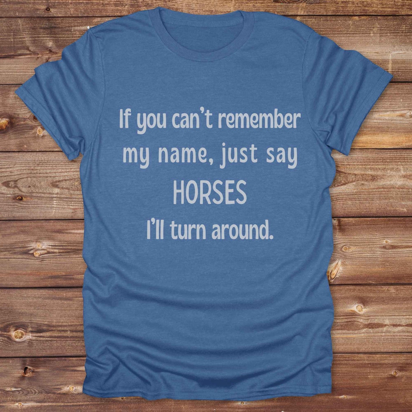 Get noticed with our hilarious “If You Can’t Remember My Name, Shout Horses” t-shirt designed for cowgirls, cowboys, and horse lovers who live for western humor and barn life. This bold, rustic graphic tee is a perfect gift for birthdays, rodeo events, or just showing off your horse obsession. Made for comfort and laughs, it's the ideal shirt for stables, trail rides, and every country concert. Cowgirl up and shout your style loud and proud. From rustic charm to rodeo ready sass, this shirt says it all!
