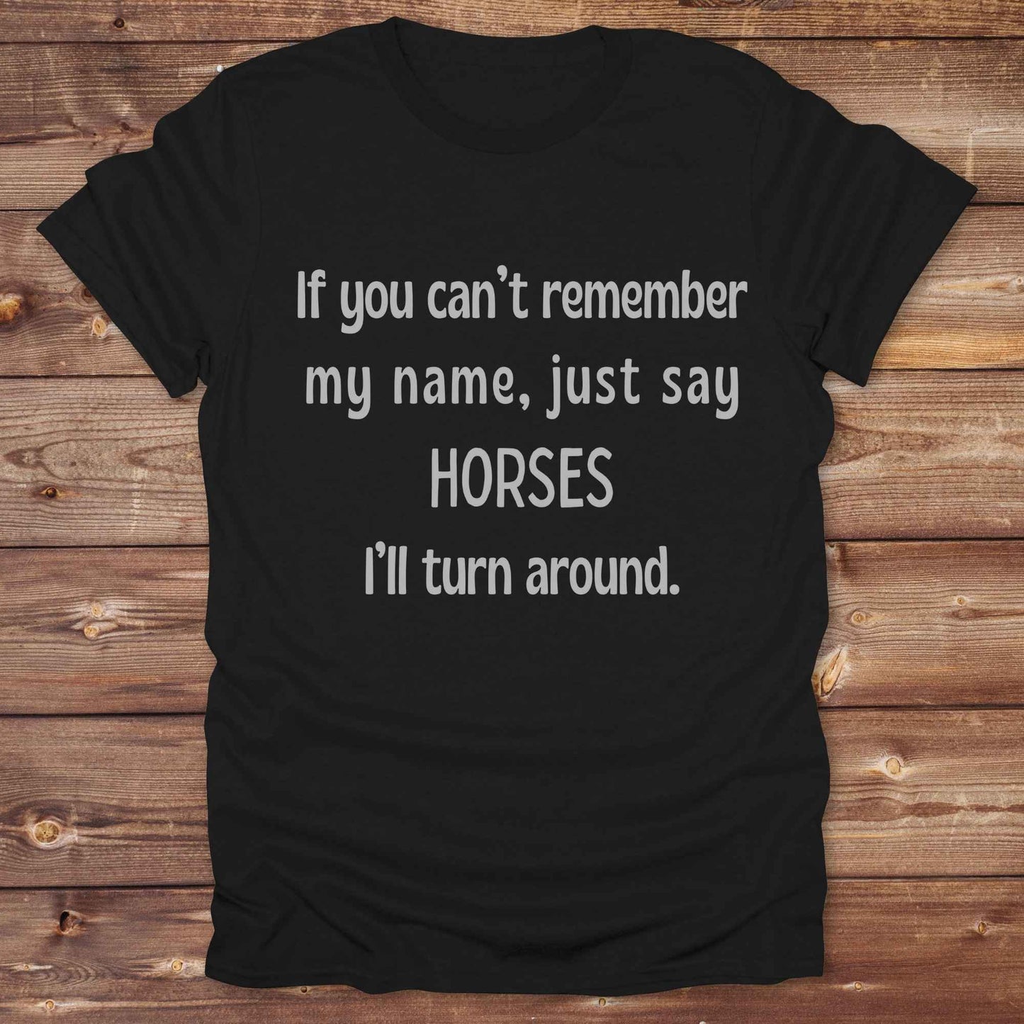 Get noticed with our hilarious “If You Can’t Remember My Name, Shout Horses” t-shirt designed for cowgirls, cowboys, and horse lovers who live for western humor and barn life. This bold, rustic graphic tee is a perfect gift for birthdays, rodeo events, or just showing off your horse obsession. Made for comfort and laughs, it's the ideal shirt for stables, trail rides, and every country concert. Cowgirl up and shout your style loud and proud. From rustic charm to rodeo ready sass, this shirt says it all!