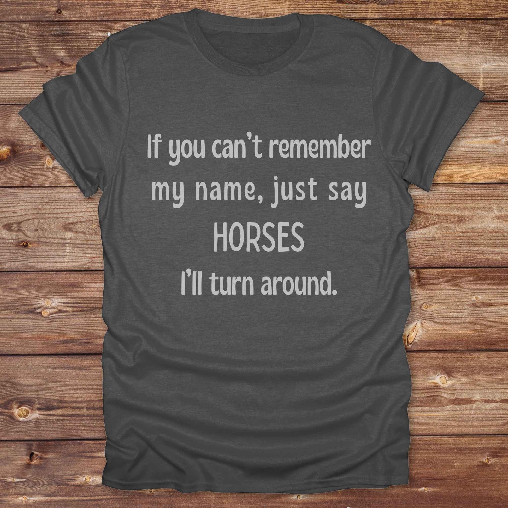 Get noticed with our hilarious “If You Can’t Remember My Name, Shout Horses” t-shirt designed for cowgirls, cowboys, and horse lovers who live for western humor and barn life. This bold, rustic graphic tee is a perfect gift for birthdays, rodeo events, or just showing off your horse obsession. Made for comfort and laughs, it's the ideal shirt for stables, trail rides, and every country concert. Cowgirl up and shout your style loud and proud. From rustic charm to rodeo ready sass, this shirt says it all!