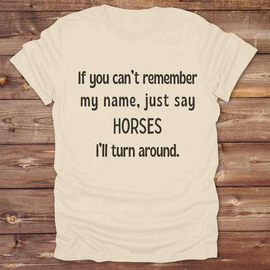 Get noticed with our hilarious “If You Can’t Remember My Name, Shout Horses” t-shirt designed for cowgirls, cowboys, and horse lovers who live for western humor and barn life. This bold, rustic graphic tee is a perfect gift for birthdays, rodeo events, or just showing off your horse obsession. Made for comfort and laughs, it's the ideal shirt for stables, trail rides, and every country concert. Cowgirl up and shout your style loud and proud. From rustic charm to rodeo ready sass, this shirt says it all!