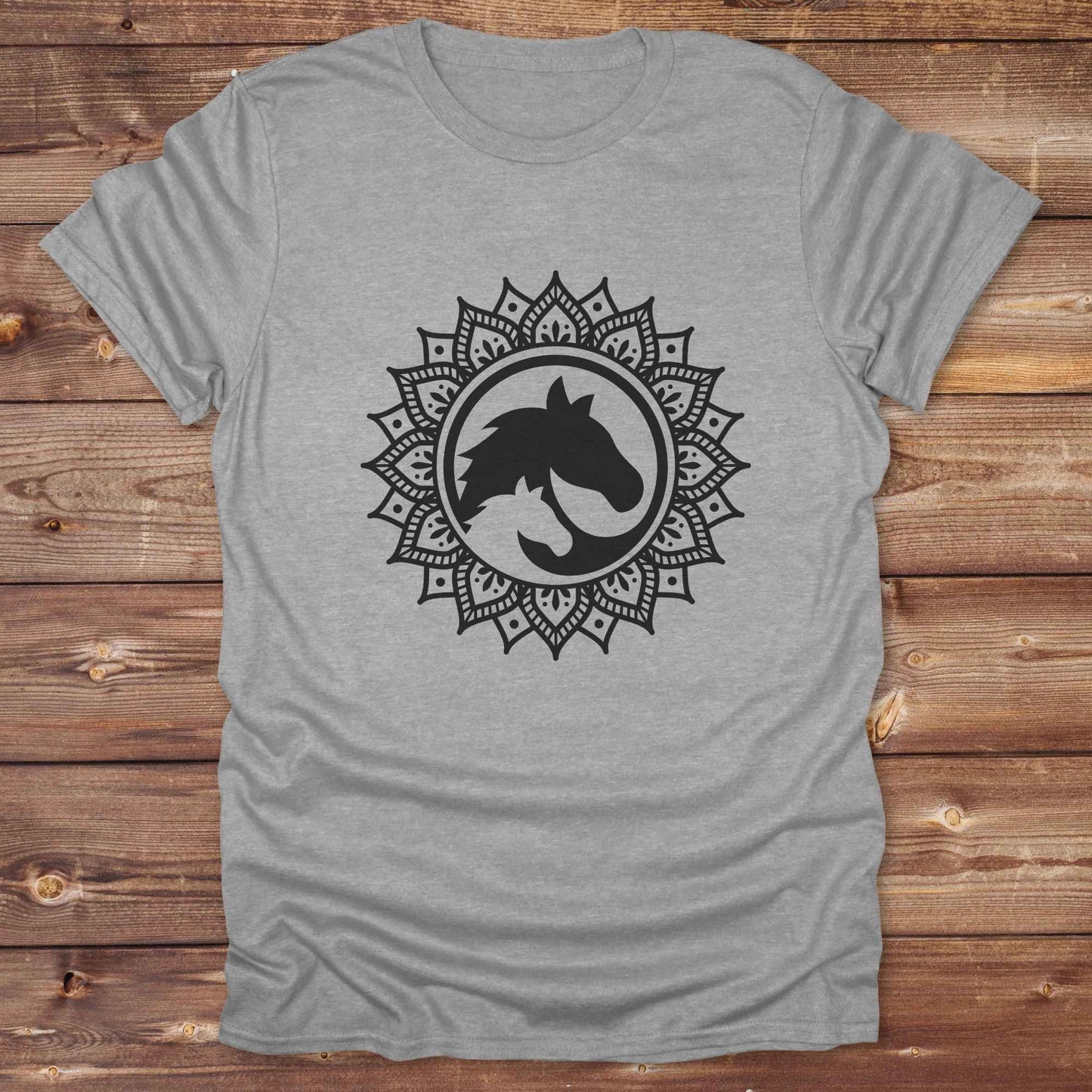 Mandala Horse T-Shirt combines boho spirituality and western soul, perfect for cowgirls, cowboys, horse lovers, and rodeo fans. Features an intricate mandala design with a majestic horse at the center, this tee speaks to those who love rustic country style with spiritual flair. Whether you're trail riding, heading to a barn dance, or simply showing off your equestrian pride, this shirt is the ideal blend of comfort and expression. Designed for mindful western wearers and horse lovers alike, birthdays