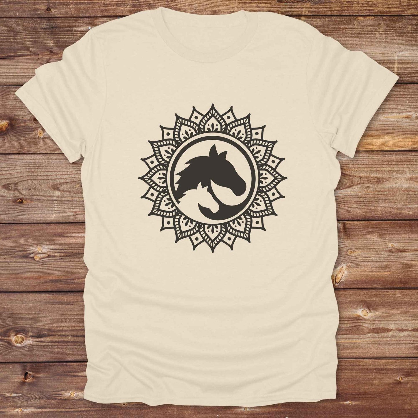 Mandala Horse T-Shirt combines boho spirituality and western soul, perfect for cowgirls, cowboys, horse lovers, and rodeo fans. Features an intricate mandala design with a majestic horse at the center, this tee speaks to those who love rustic country style with spiritual flair. Whether you're trail riding, heading to a barn dance, or simply showing off your equestrian pride, this shirt is the ideal blend of comfort and expression. Designed for mindful western wearers and horse lovers alike, birthdays