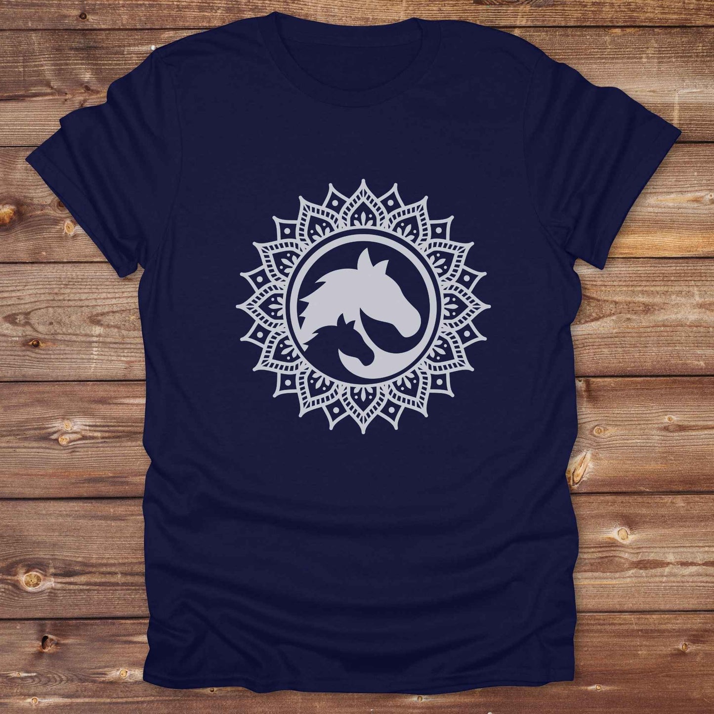 Mandala Horse T-Shirt combines boho spirituality and western soul, perfect for cowgirls, cowboys, horse lovers, and rodeo fans. Features an intricate mandala design with a majestic horse at the center, this tee speaks to those who love rustic country style with spiritual flair. Whether you're trail riding, heading to a barn dance, or simply showing off your equestrian pride, this shirt is the ideal blend of comfort and expression. Designed for mindful western wearers and horse lovers alike, birthdays