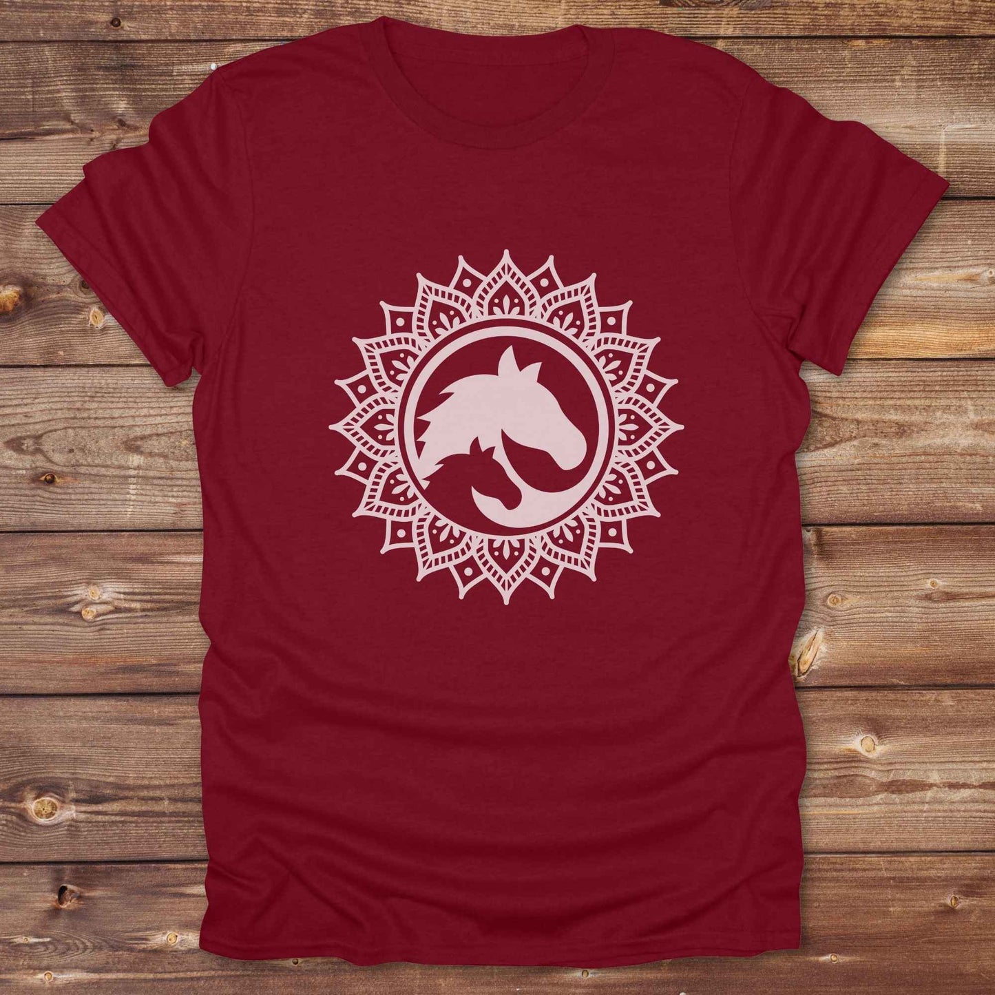 Mandala Horse T-Shirt combines boho spirituality and western soul, perfect for cowgirls, cowboys, horse lovers, and rodeo fans. Features an intricate mandala design with a majestic horse at the center, this tee speaks to those who love rustic country style with spiritual flair. Whether you're trail riding, heading to a barn dance, or simply showing off your equestrian pride, this shirt is the ideal blend of comfort and expression. Designed for mindful western wearers and horse lovers alike, birthdays