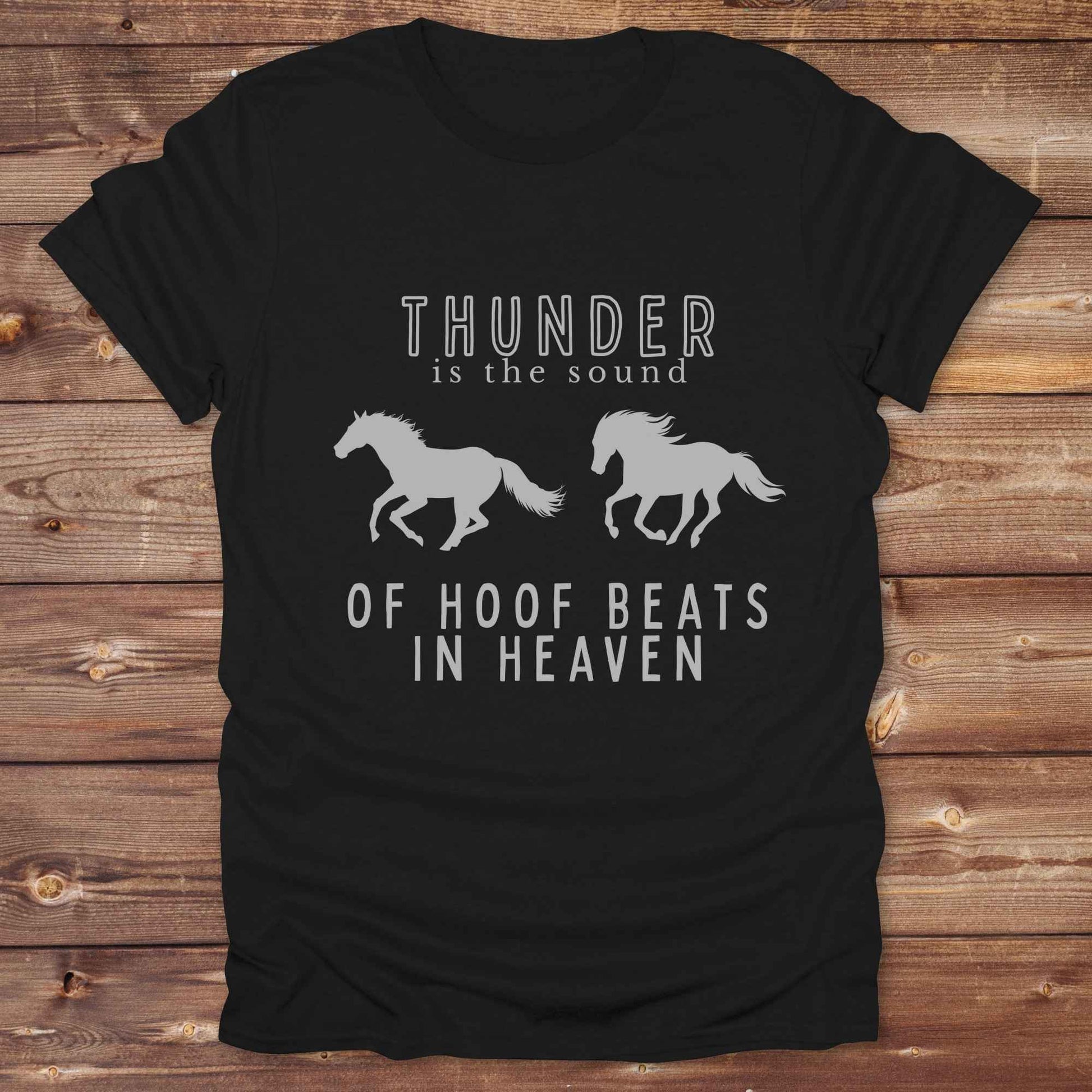 Saddle up with our “Hoof Beats in Heaven” Western Tee – the perfect tribute to your love for horses, riding, and country life. Featuring bold galloping horse graphics and the quote “Thunder is the sound of hoof beats in heaven,” this shirt is made for cowgirls, cowboys, and western soul seekers. Ideal for rodeo lovers, country music fans, and horse memorial gifts. It’s a versatile piece for ranch days, casual outings, or as a thoughtful gift.