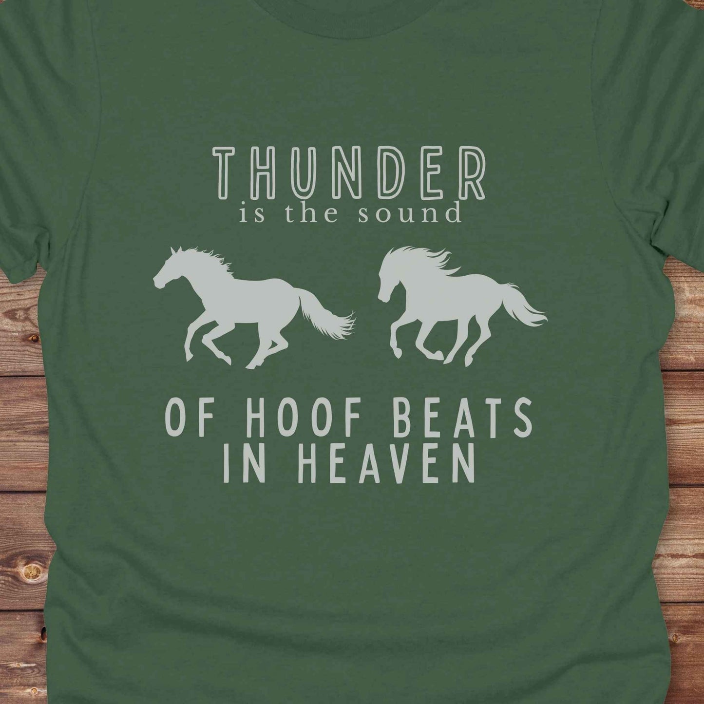 Saddle up with our “Hoof Beats in Heaven” Western Tee – the perfect tribute to your love for horses, riding, and country life. Featuring bold galloping horse graphics and the quote “Thunder is the sound of hoof beats in heaven,” this shirt is made for cowgirls, cowboys, and western soul seekers. Ideal for rodeo lovers, country music fans, and horse memorial gifts. It’s a versatile piece for ranch days, casual outings, or as a thoughtful gift.