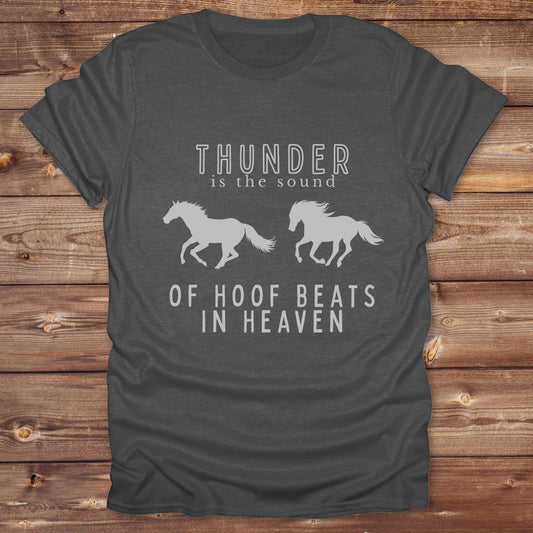 Saddle up with our “Hoof Beats in Heaven” Western Tee – the perfect tribute to your love for horses, riding, and country life. Featuring bold galloping horse graphics and the quote “Thunder is the sound of hoof beats in heaven,” this shirt is made for cowgirls, cowboys, and western soul seekers. Ideal for rodeo lovers, country music fans, and horse memorial gifts. It’s a versatile piece for ranch days, casual outings, or as a thoughtful gift.