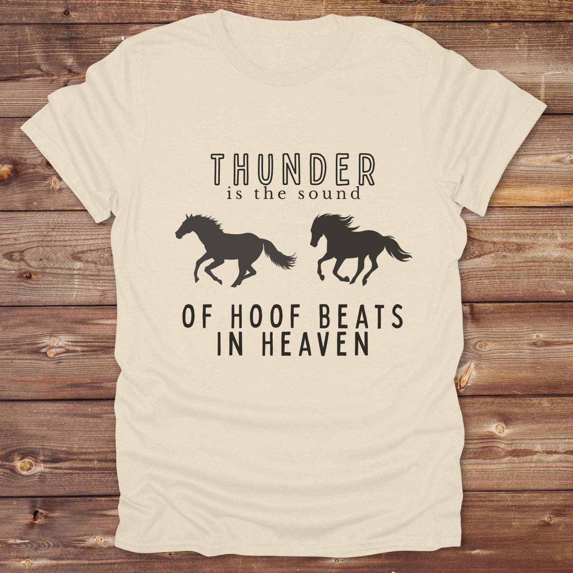 Saddle up with our “Hoof Beats in Heaven” Western Tee – the perfect tribute to your love for horses, riding, and country life. Featuring bold galloping horse graphics and the quote “Thunder is the sound of hoof beats in heaven,” this shirt is made for cowgirls, cowboys, and western soul seekers. Ideal for rodeo lovers, country music fans, and horse memorial gifts. It’s a versatile piece for ranch days, casual outings, or as a thoughtful gift.