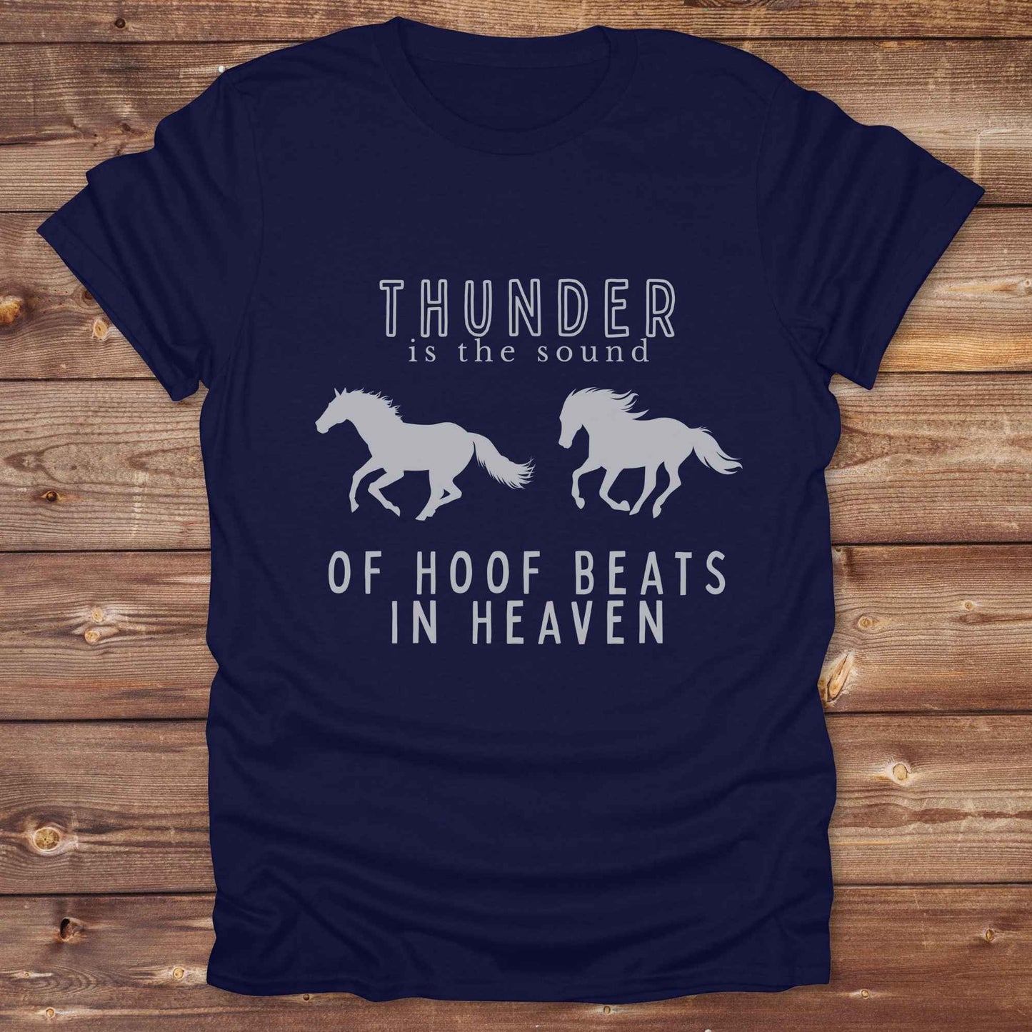 Saddle up with our “Hoof Beats in Heaven” Western Tee – the perfect tribute to your love for horses, riding, and country life. Featuring bold galloping horse graphics and the quote “Thunder is the sound of hoof beats in heaven,” this shirt is made for cowgirls, cowboys, and western soul seekers. Ideal for rodeo lovers, country music fans, and horse memorial gifts. It’s a versatile piece for ranch days, casual outings, or as a thoughtful gift.