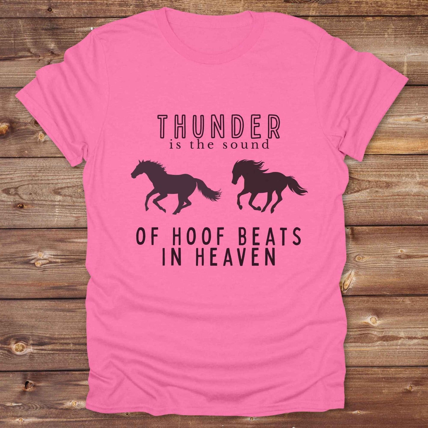 Saddle up with our “Hoof Beats in Heaven” Western Tee – the perfect tribute to your love for horses, riding, and country life. Featuring bold galloping horse graphics and the quote “Thunder is the sound of hoof beats in heaven,” this shirt is made for cowgirls, cowboys, and western soul seekers. Ideal for rodeo lovers, country music fans, and horse memorial gifts. It’s a versatile piece for ranch days, casual outings, or as a thoughtful gift.