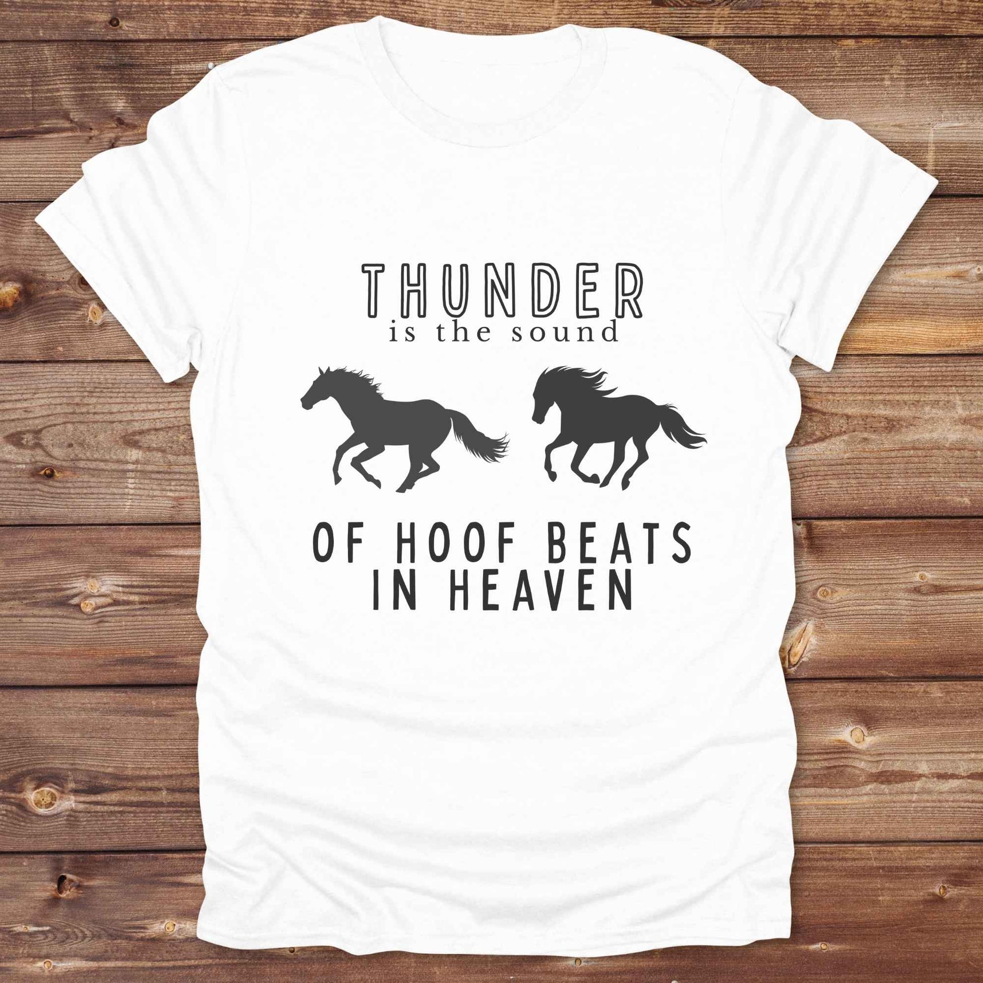 Saddle up with our “Hoof Beats in Heaven” Western Tee – the perfect tribute to your love for horses, riding, and country life. Featuring bold galloping horse graphics and the quote “Thunder is the sound of hoof beats in heaven,” this shirt is made for cowgirls, cowboys, and western soul seekers. Ideal for rodeo lovers, country music fans, and horse memorial gifts. It’s a versatile piece for ranch days, casual outings, or as a thoughtful gift.