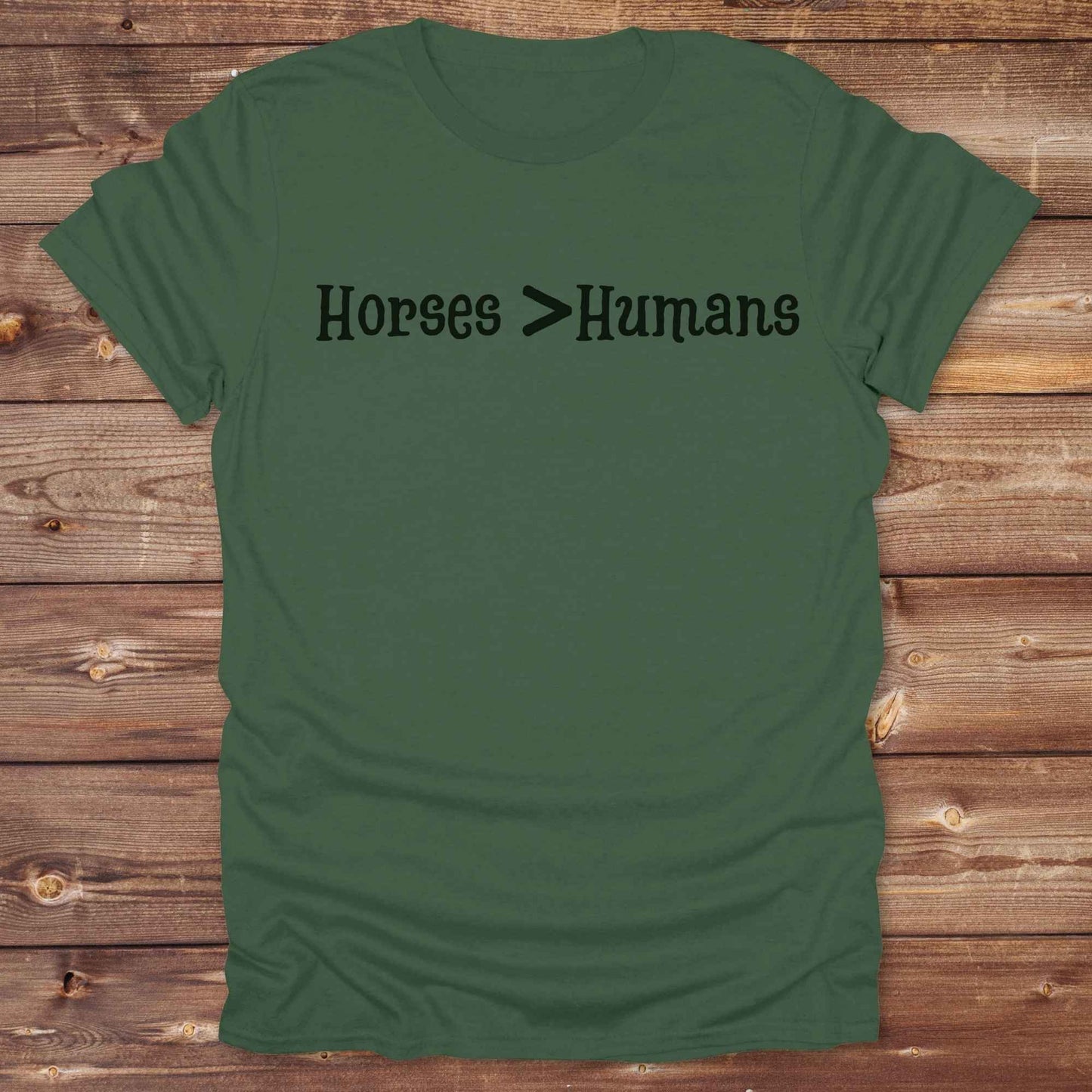 Show off your equestrian spirit with our “Horses > Humans” western t-shirt — made for horse lovers with a sense of humor. This minimal black design says it all: horses are better than people, period. Perfect for cowgirls, cowboys, equestrians, rodeo fans, and sarcastic ranch folk who know where their loyalty lies. Whether you're gifting it to a horse girl or repping it at a rodeo, this tee delivers comfort, country attitude, and all the sass.