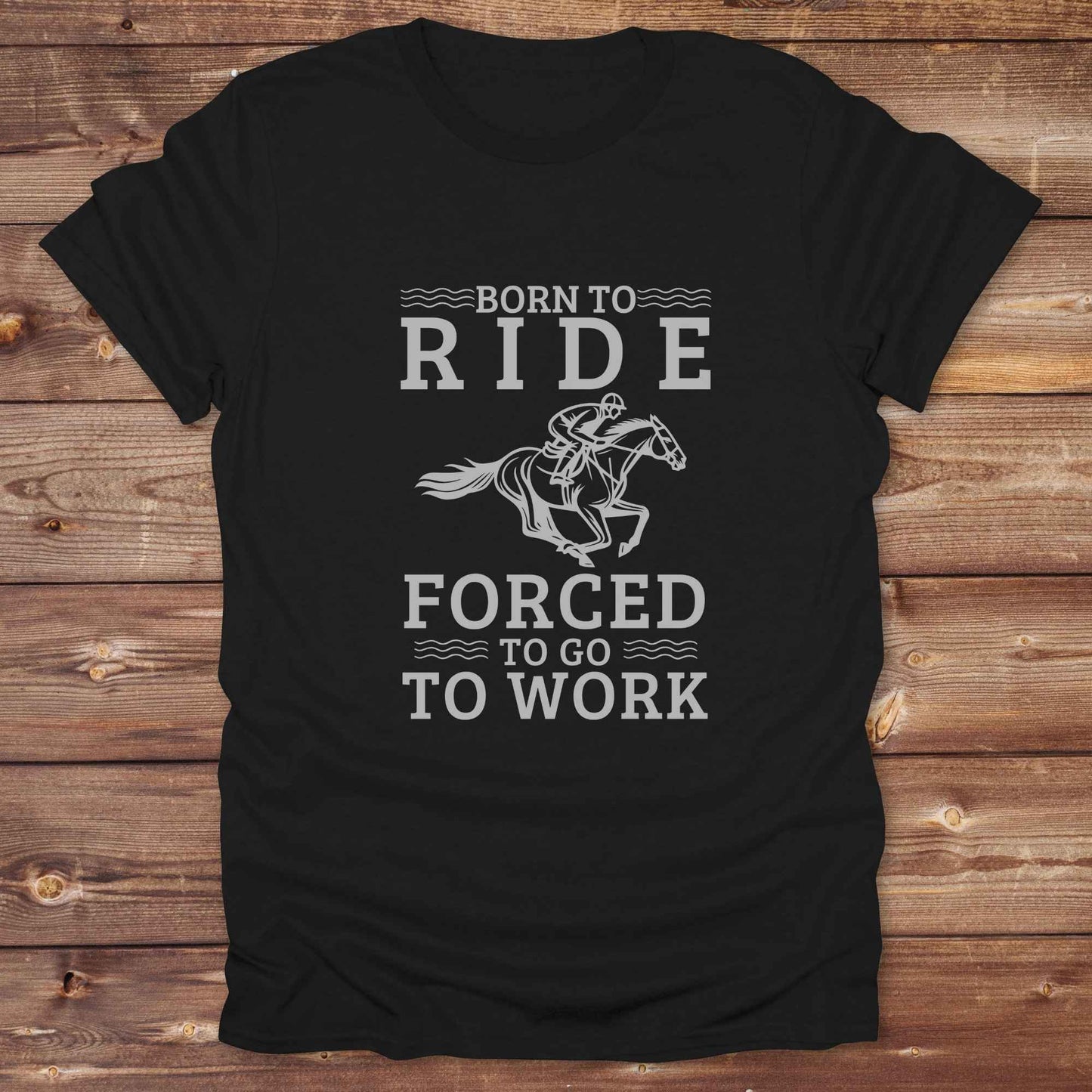 This "Born to Ride, Forced to Go to Work" western t-shirt is perfect for every horse lover who'd rather be riding than reporting to the office. Designed for cowgirls, cowboys, and country soul riders, it blends bold typography with a clean, classic horse graphic. The tee is ideal for rodeo nights, barn life, gifting equestrian moms, or simply expressing your true identity at work.