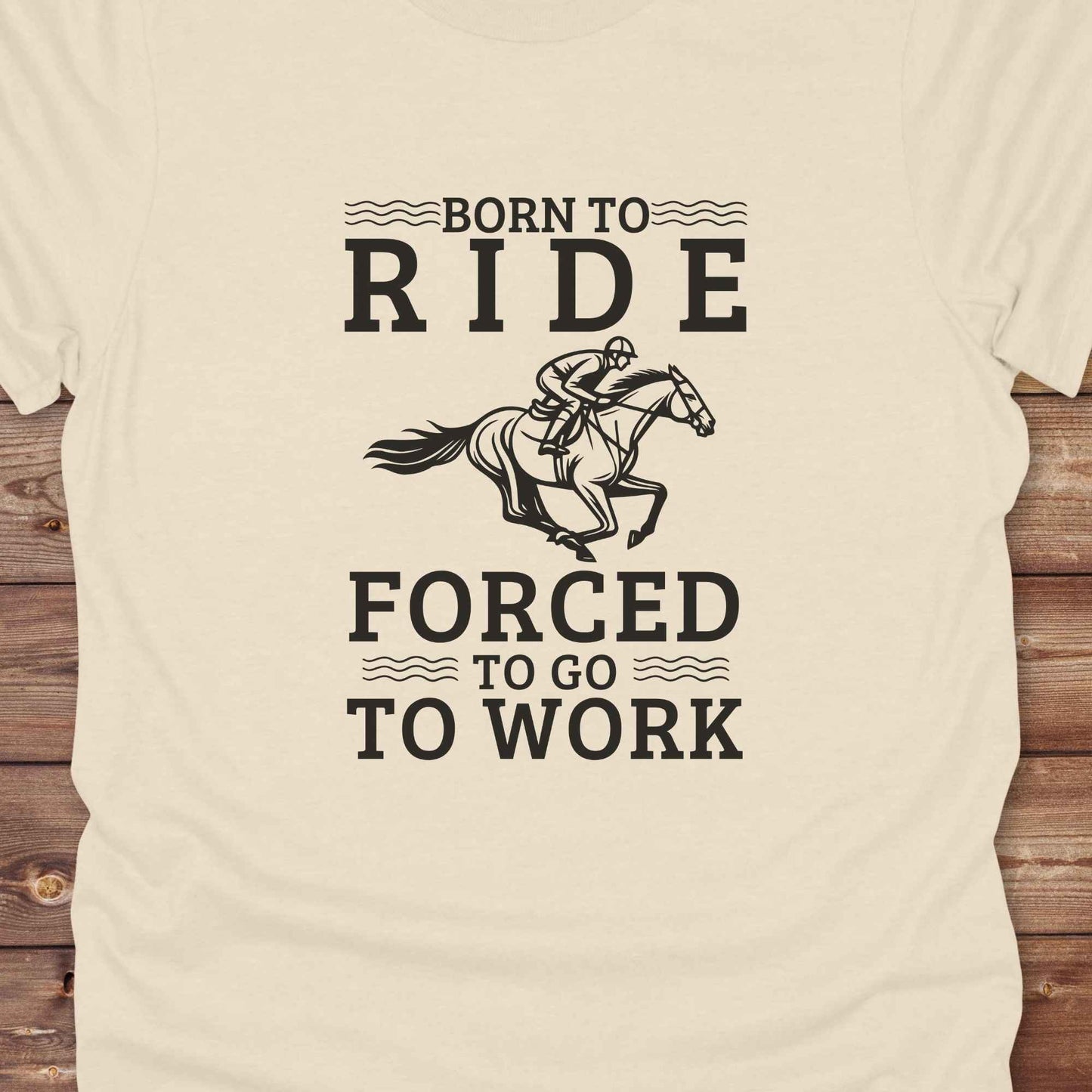 This "Born to Ride, Forced to Go to Work" western t-shirt is perfect for every horse lover who'd rather be riding than reporting to the office. Designed for cowgirls, cowboys, and country soul riders, it blends bold typography with a clean, classic horse graphic. The tee is ideal for rodeo nights, barn life, gifting equestrian moms, or simply expressing your true identity at work.