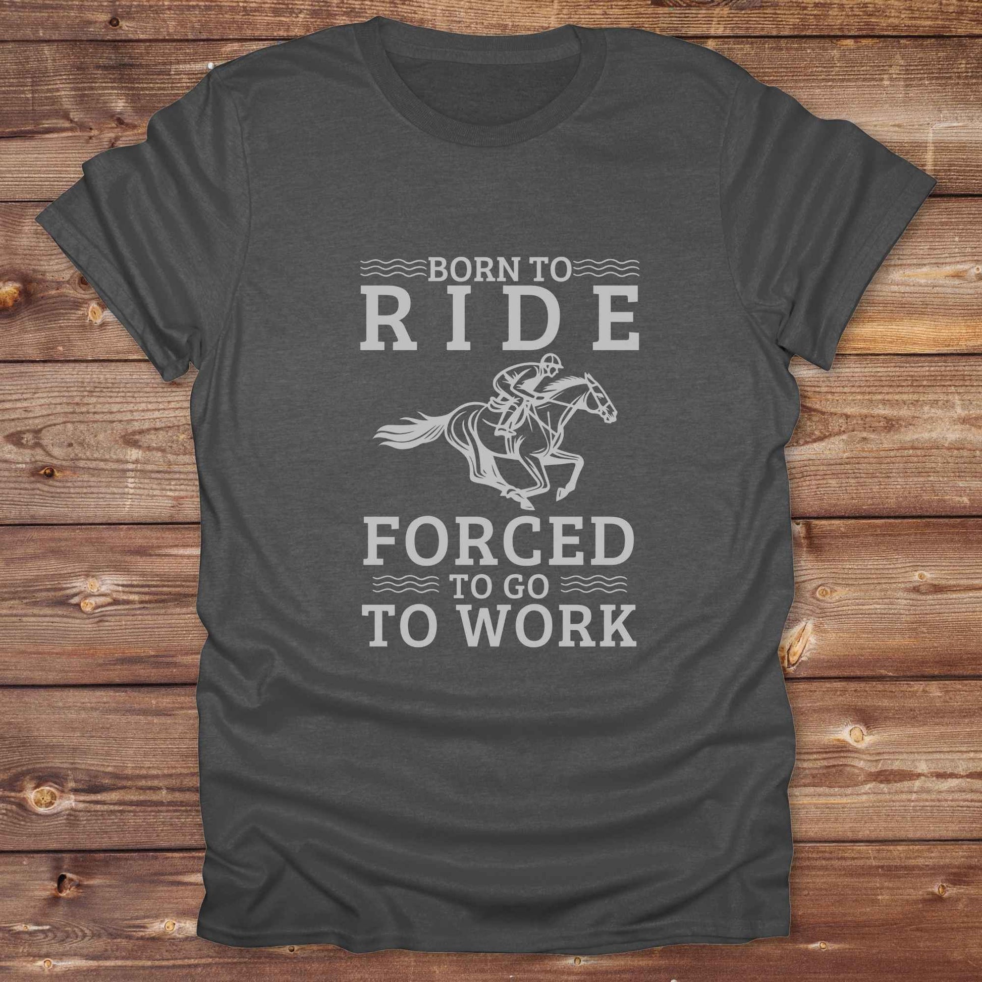 This "Born to Ride, Forced to Go to Work" western t-shirt is perfect for every horse lover who'd rather be riding than reporting to the office. Designed for cowgirls, cowboys, and country soul riders, it blends bold typography with a clean, classic horse graphic. The tee is ideal for rodeo nights, barn life, gifting equestrian moms, or simply expressing your true identity at work.