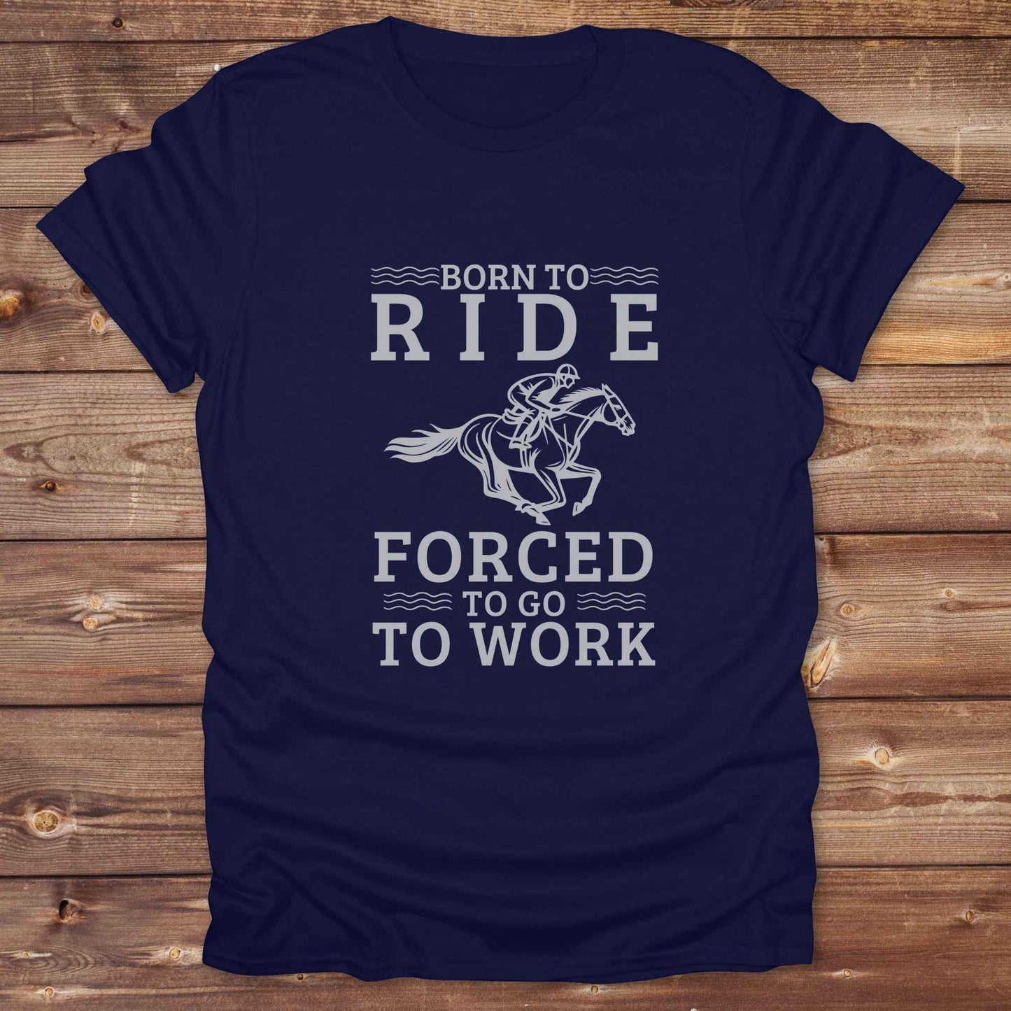 This "Born to Ride, Forced to Go to Work" western t-shirt is perfect for every horse lover who'd rather be riding than reporting to the office. Designed for cowgirls, cowboys, and country soul riders, it blends bold typography with a clean, classic horse graphic. The tee is ideal for rodeo nights, barn life, gifting equestrian moms, or simply expressing your true identity at work.