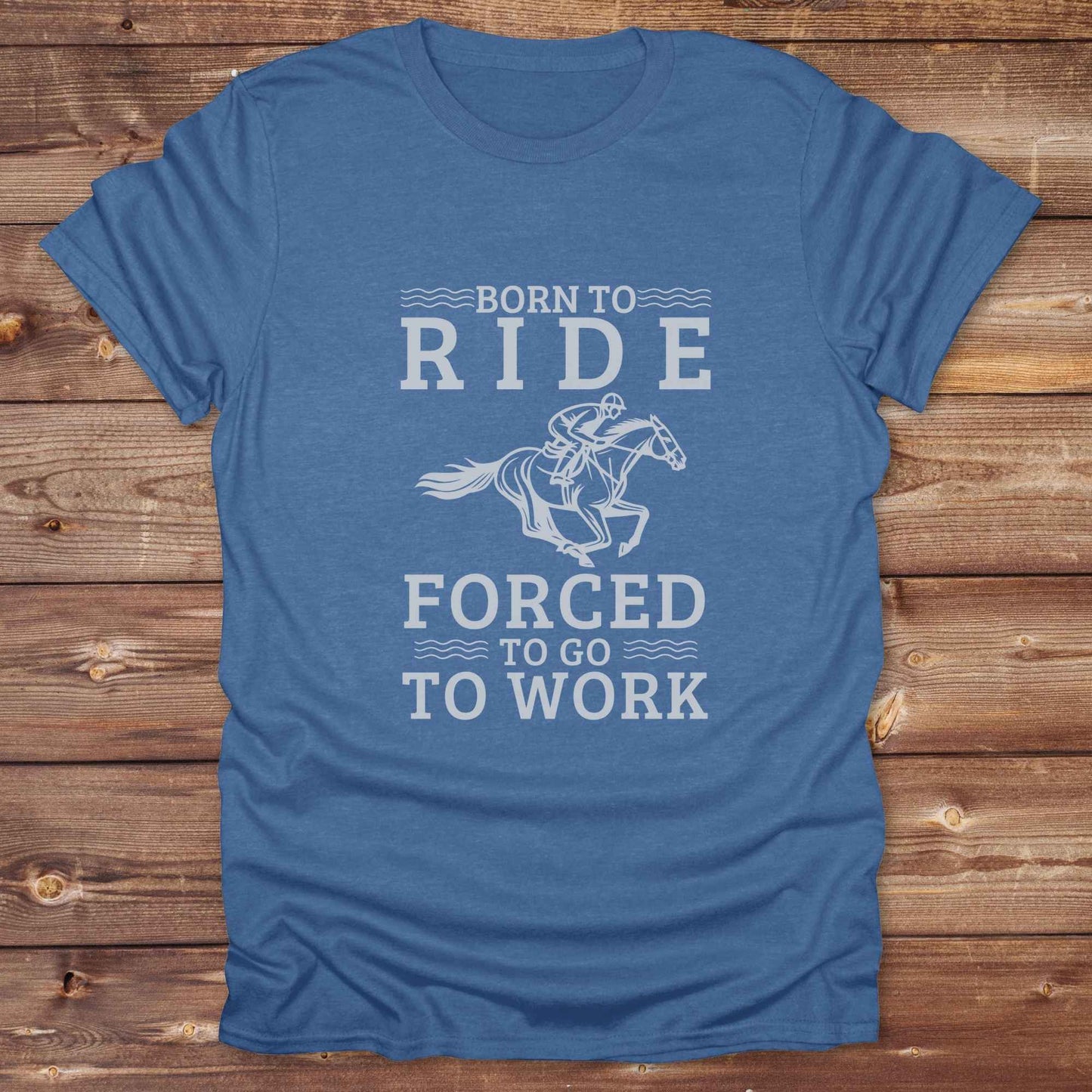 This "Born to Ride, Forced to Go to Work" western t-shirt is perfect for every horse lover who'd rather be riding than reporting to the office. Designed for cowgirls, cowboys, and country soul riders, it blends bold typography with a clean, classic horse graphic. The tee is ideal for rodeo nights, barn life, gifting equestrian moms, or simply expressing your true identity at work.