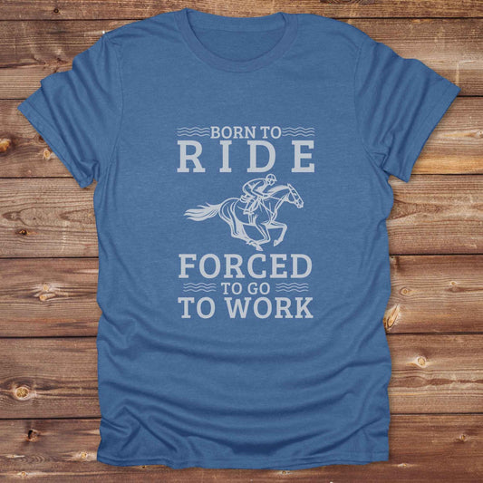 This "Born to Ride, Forced to Go to Work" western t-shirt is perfect for every horse lover who'd rather be riding than reporting to the office. Designed for cowgirls, cowboys, and country soul riders, it blends bold typography with a clean, classic horse graphic. The tee is ideal for rodeo nights, barn life, gifting equestrian moms, or simply expressing your true identity at work.