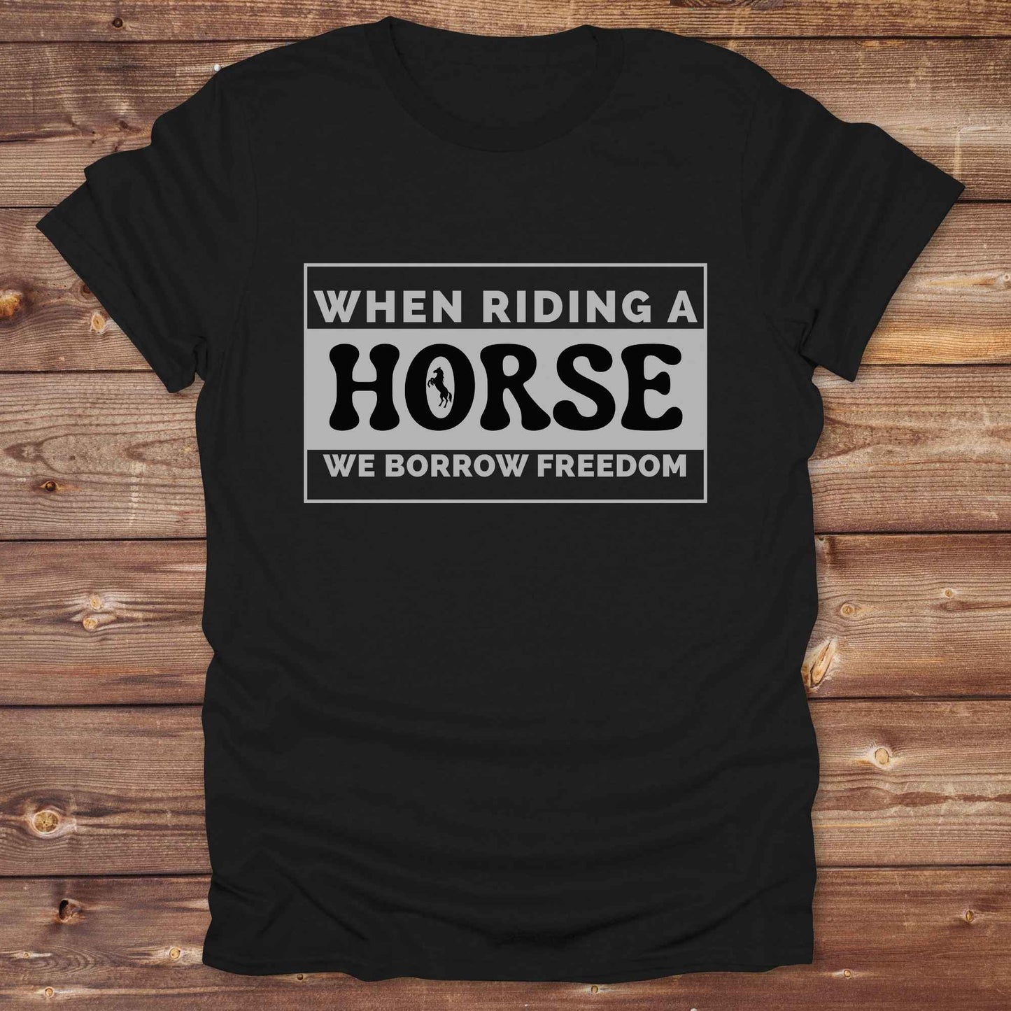 Wear your spirit of freedom with our Borrow Freedom Horse T‑Shirt. Perfect for cowgirls, cowboys, rodeo lovers, and horse enthusiasts, this western graphic tee combines vintage charm with modern comfort. A standout gift idea for birthdays, anniversaries, or just because this unisex horse lover shirt elevates country style while celebrating equestrian passion.