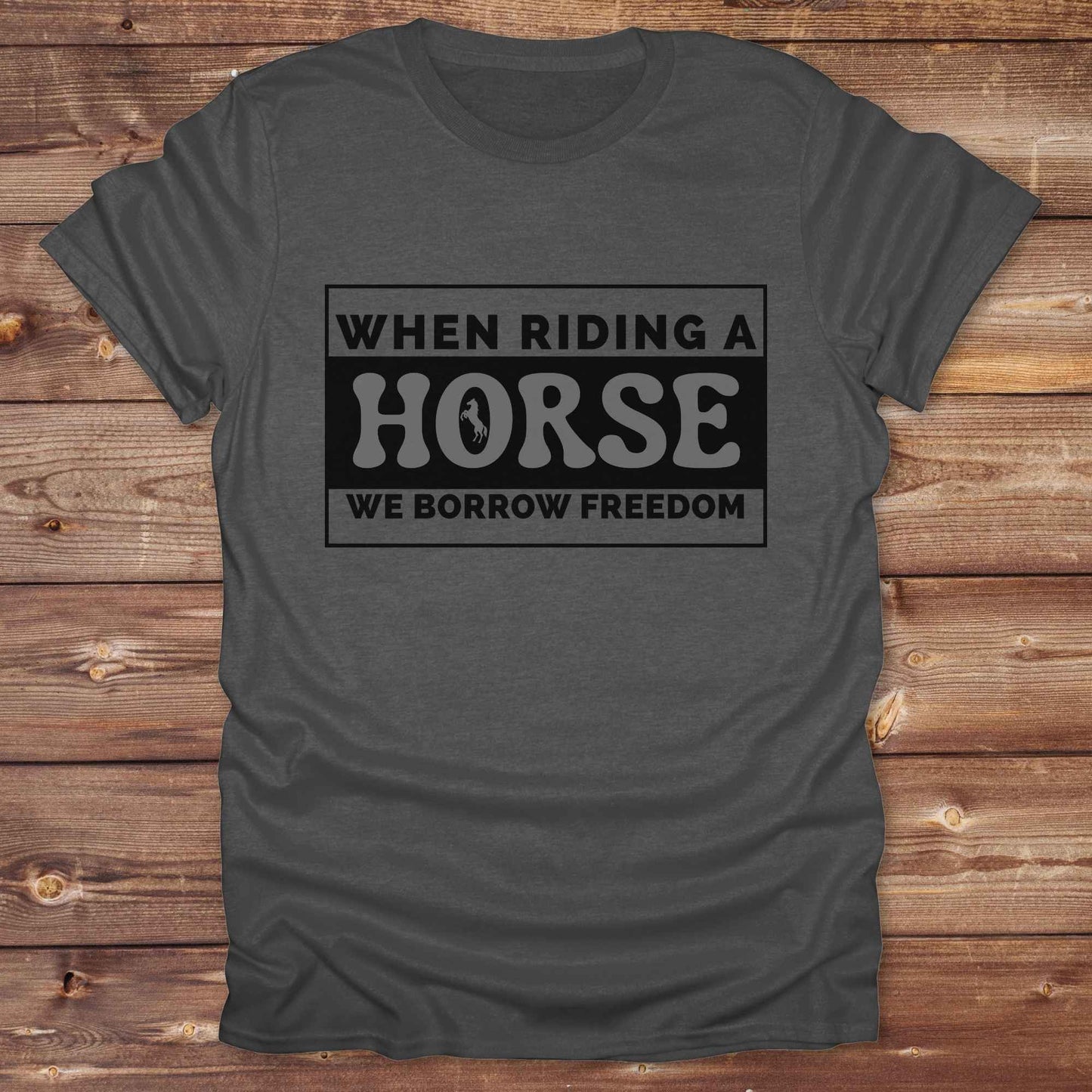 Wear your spirit of freedom with our Borrow Freedom Horse T‑Shirt. Perfect for cowgirls, cowboys, rodeo lovers, and horse enthusiasts, this western graphic tee combines vintage charm with modern comfort. A standout gift idea for birthdays, anniversaries, or just because this unisex horse lover shirt elevates country style while celebrating equestrian passion.