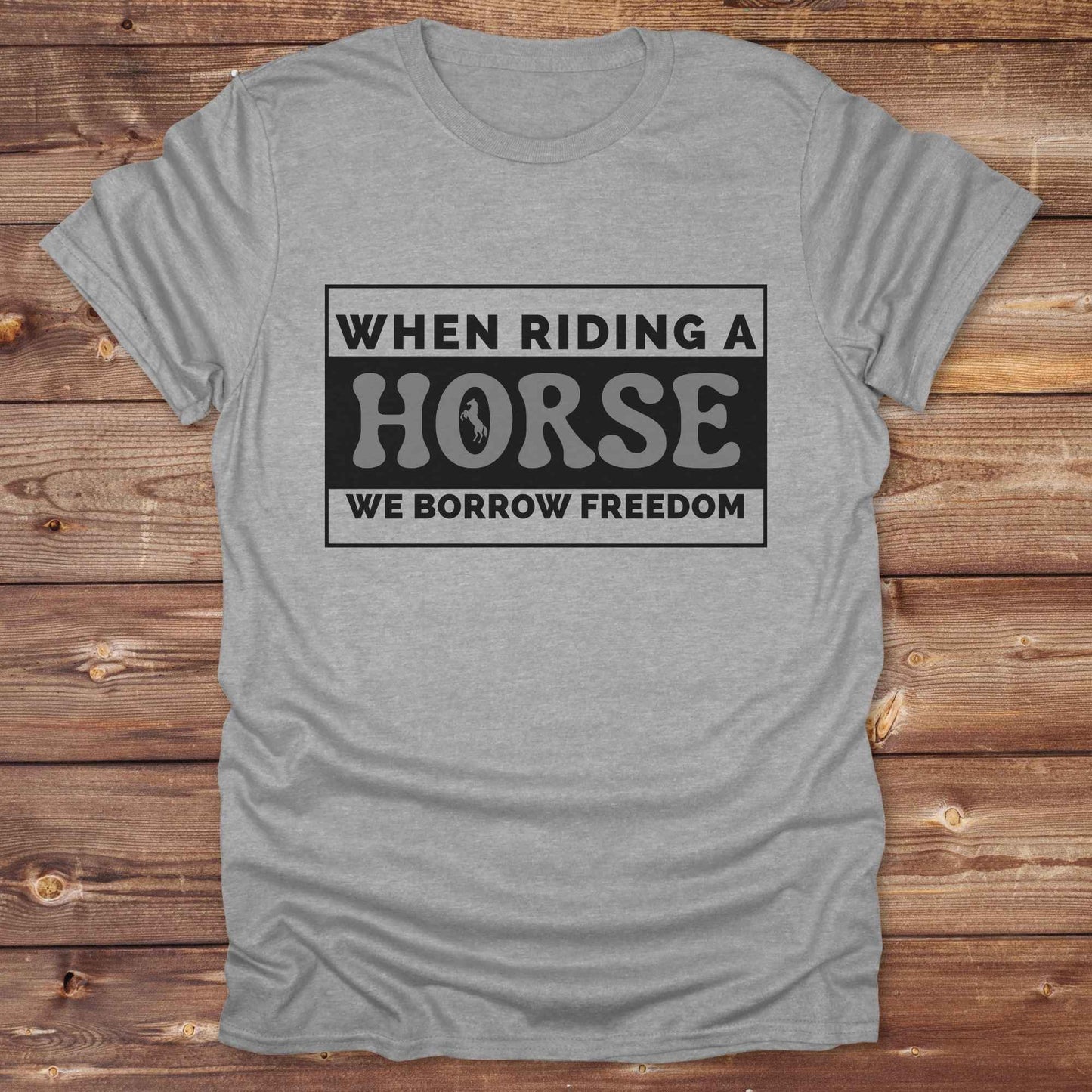 Wear your spirit of freedom with our Borrow Freedom Horse T‑Shirt. Perfect for cowgirls, cowboys, rodeo lovers, and horse enthusiasts, this western graphic tee combines vintage charm with modern comfort. A standout gift idea for birthdays, anniversaries, or just because this unisex horse lover shirt elevates country style while celebrating equestrian passion.