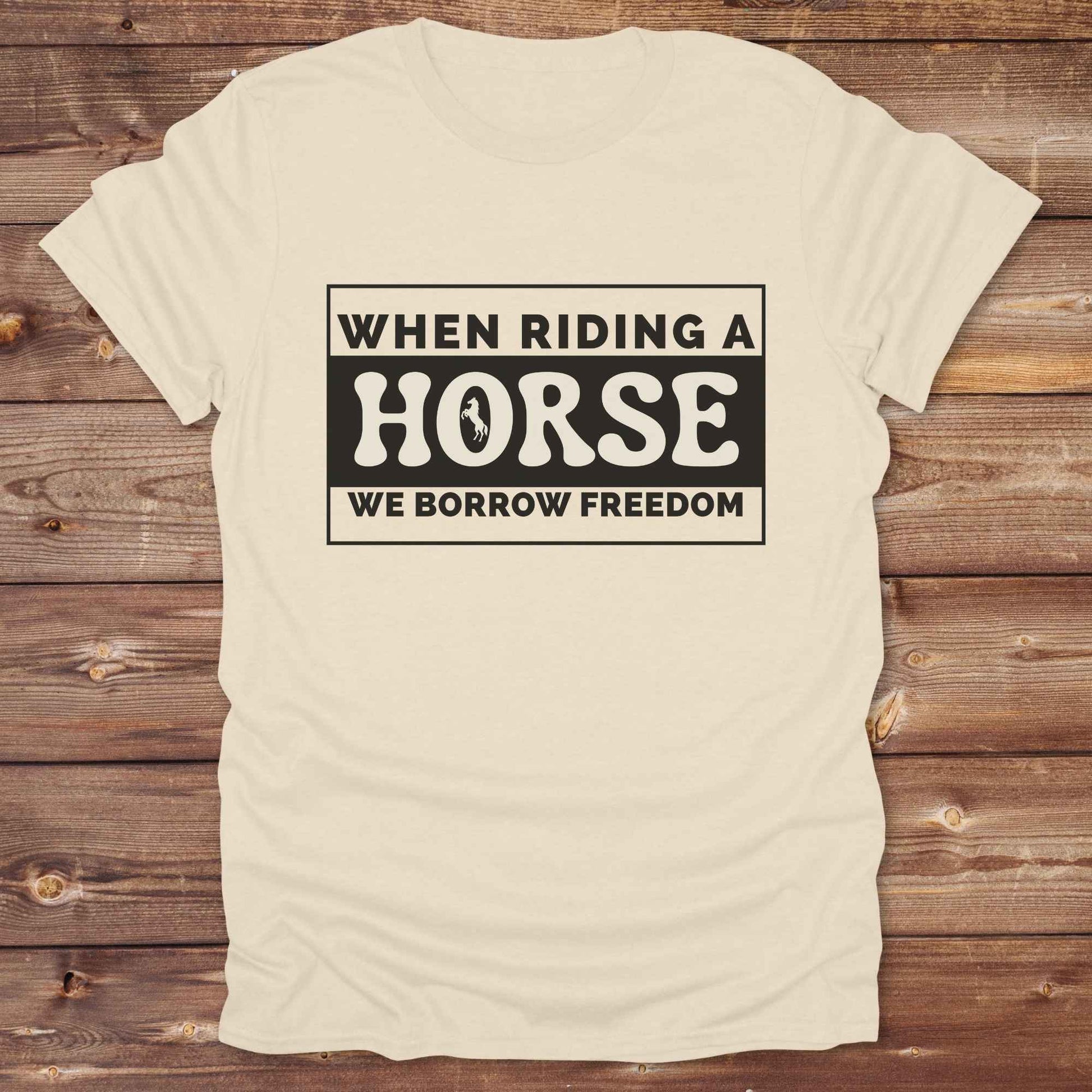 Wear your spirit of freedom with our Borrow Freedom Horse T‑Shirt. Perfect for cowgirls, cowboys, rodeo lovers, and horse enthusiasts, this western graphic tee combines vintage charm with modern comfort. A standout gift idea for birthdays, anniversaries, or just because this unisex horse lover shirt elevates country style while celebrating equestrian passion.
