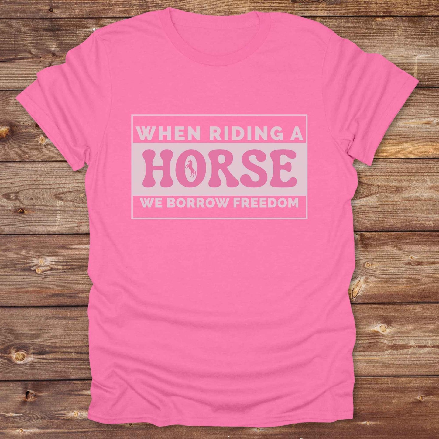 Wear your spirit of freedom with our Borrow Freedom Horse T‑Shirt. Perfect for cowgirls, cowboys, rodeo lovers, and horse enthusiasts, this western graphic tee combines vintage charm with modern comfort. A standout gift idea for birthdays, anniversaries, or just because this unisex horse lover shirt elevates country style while celebrating equestrian passion.