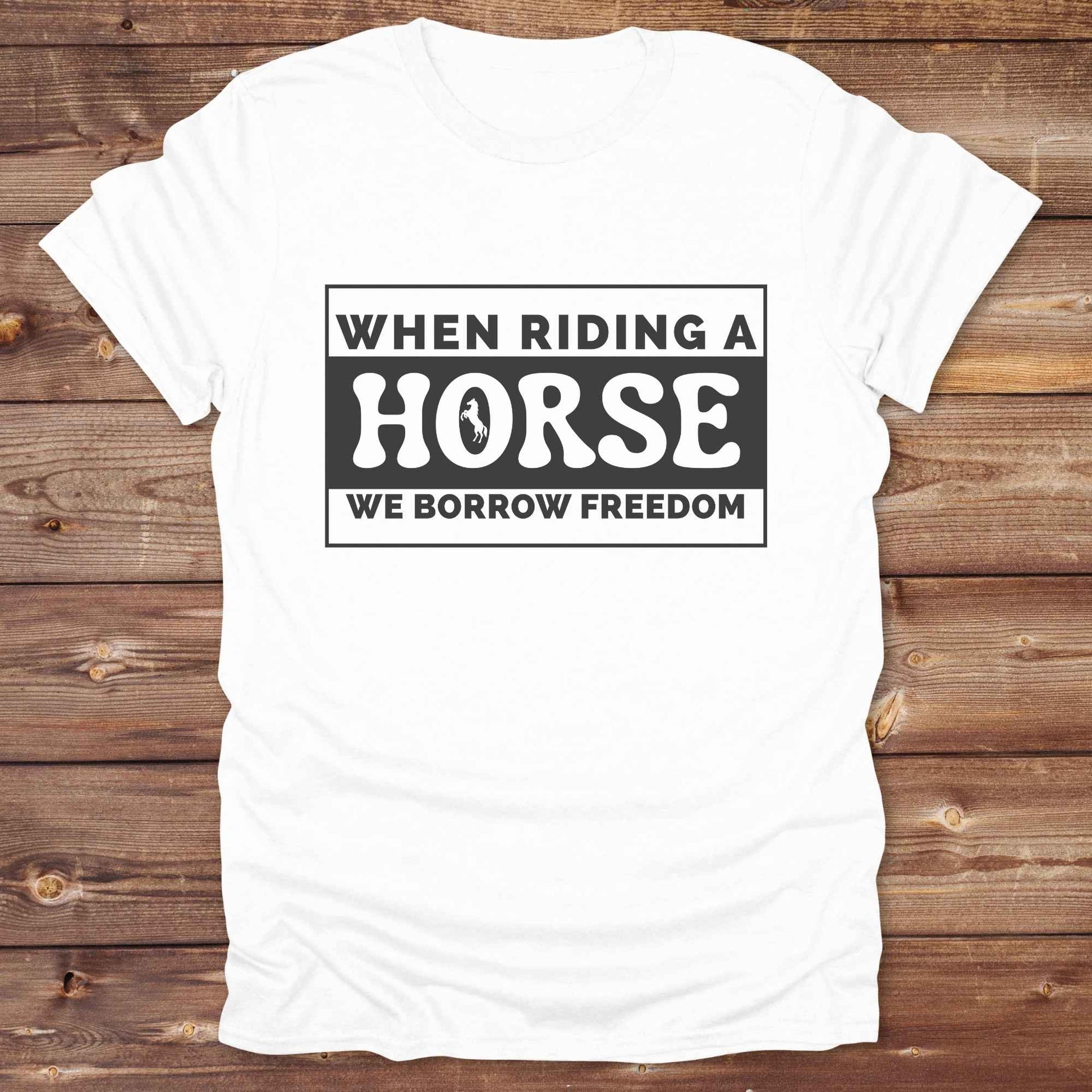 Wear your spirit of freedom with our Borrow Freedom Horse T‑Shirt. Perfect for cowgirls, cowboys, rodeo lovers, and horse enthusiasts, this western graphic tee combines vintage charm with modern comfort. A standout gift idea for birthdays, anniversaries, or just because this unisex horse lover shirt elevates country style while celebrating equestrian passion.