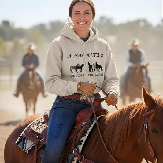 Woman riding a horse wearing a hoodie with 'Horse Math' text, with other riders in the background. Horse Maths Hoodie for Horse Lovers, Barn Wear Riding Apparel, Trail Riding Hoodie