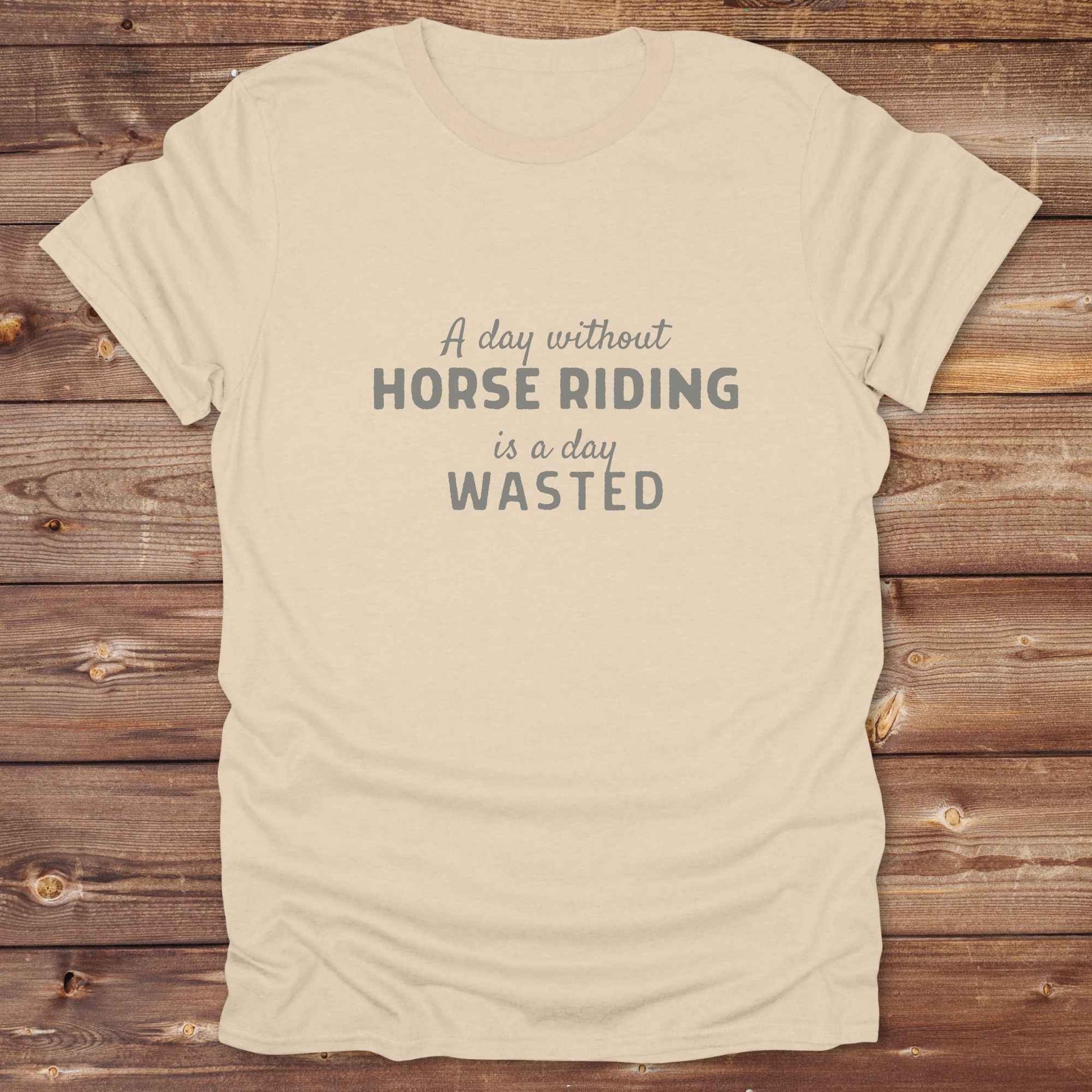 sand beige western tee with horse lover quote. Day without riding is a day wasted. Funny tee for birthday gifts.