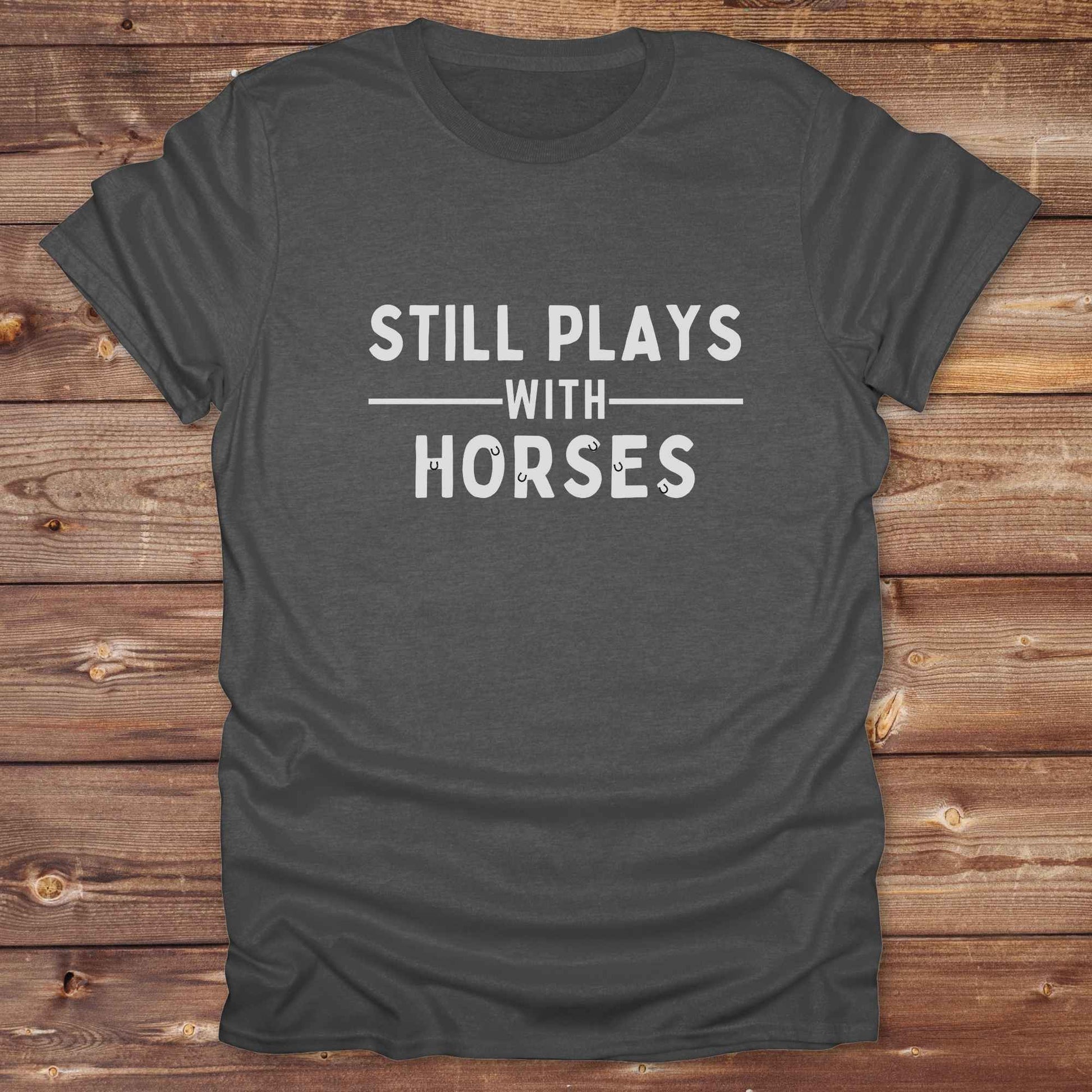 Fun western t-shirt for horse lovers and cowgirls. Western cowgirl graphic tee with horse design. Cowboy humor t-shirt for rodeo and country lovers. Horse lover funny t-shirt with western theme. Country style horse graphic tee for cowboys and cowgirls. Retro style funny western shirt for equestrians. Cute and funny country shirt with horse print. Southern cowgirl funny quote shirt for horse lovers. Still plays with horses.