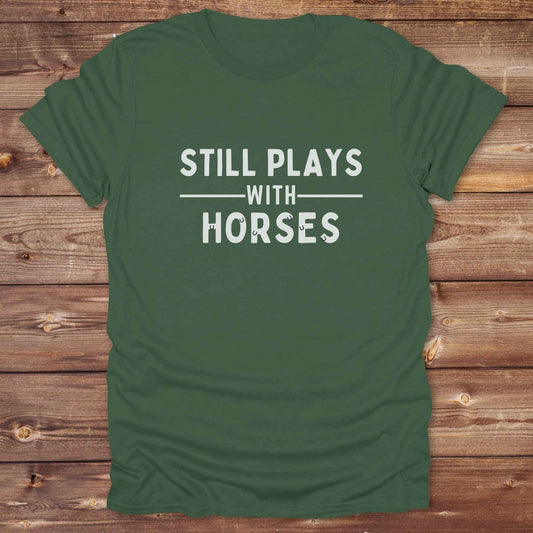 Fun western t-shirt for horse lovers and cowgirls. Western cowgirl graphic tee with horse design. Cowboy humor t-shirt for rodeo and country lovers. Horse lover funny t-shirt with western theme. Country style horse graphic tee for cowboys and cowgirls. Retro style funny western shirt for equestrians. Cute and funny country shirt with horse print. Southern cowgirl funny quote shirt for horse lovers. Still plays with horses.
