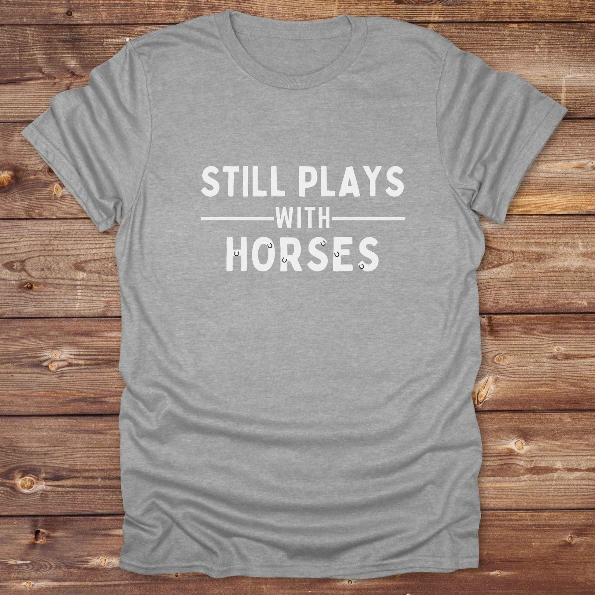 Fun western t-shirt for horse lovers and cowgirls. Western cowgirl graphic tee with horse design. Cowboy humor t-shirt for rodeo and country lovers. Horse lover funny t-shirt with western theme. Country style horse graphic tee for cowboys and cowgirls. Retro style funny western shirt for equestrians. Cute and funny country shirt with horse print. Southern cowgirl funny quote shirt for horse lovers. Still plays with horses.