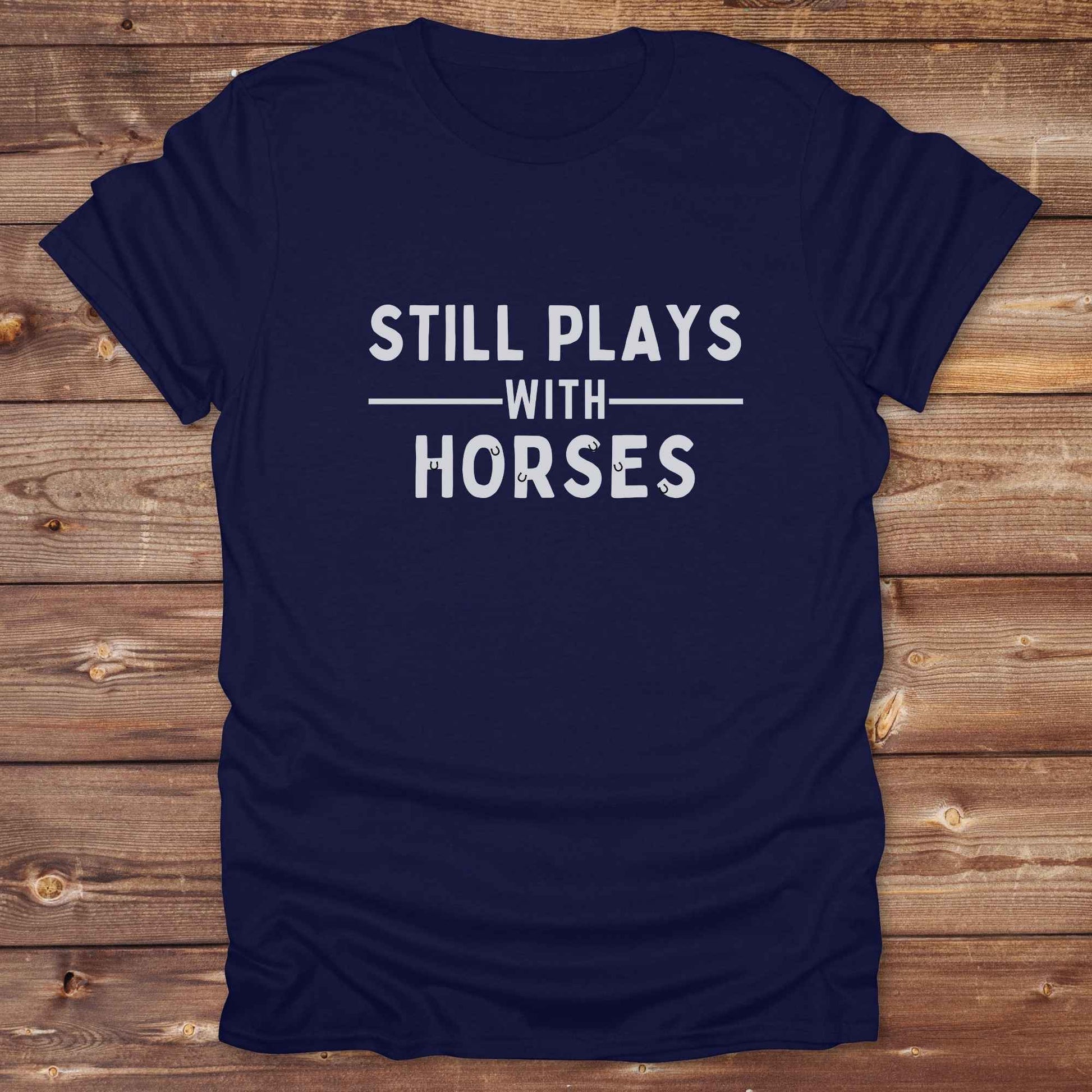 Fun western t-shirt for horse lovers and cowgirls. Western cowgirl graphic tee with horse design. Cowboy humor t-shirt for rodeo and country lovers. Horse lover funny t-shirt with western theme. Country style horse graphic tee for cowboys and cowgirls. Retro style funny western shirt for equestrians. Cute and funny country shirt with horse print. Southern cowgirl funny quote shirt for horse lovers. Still plays with horses.