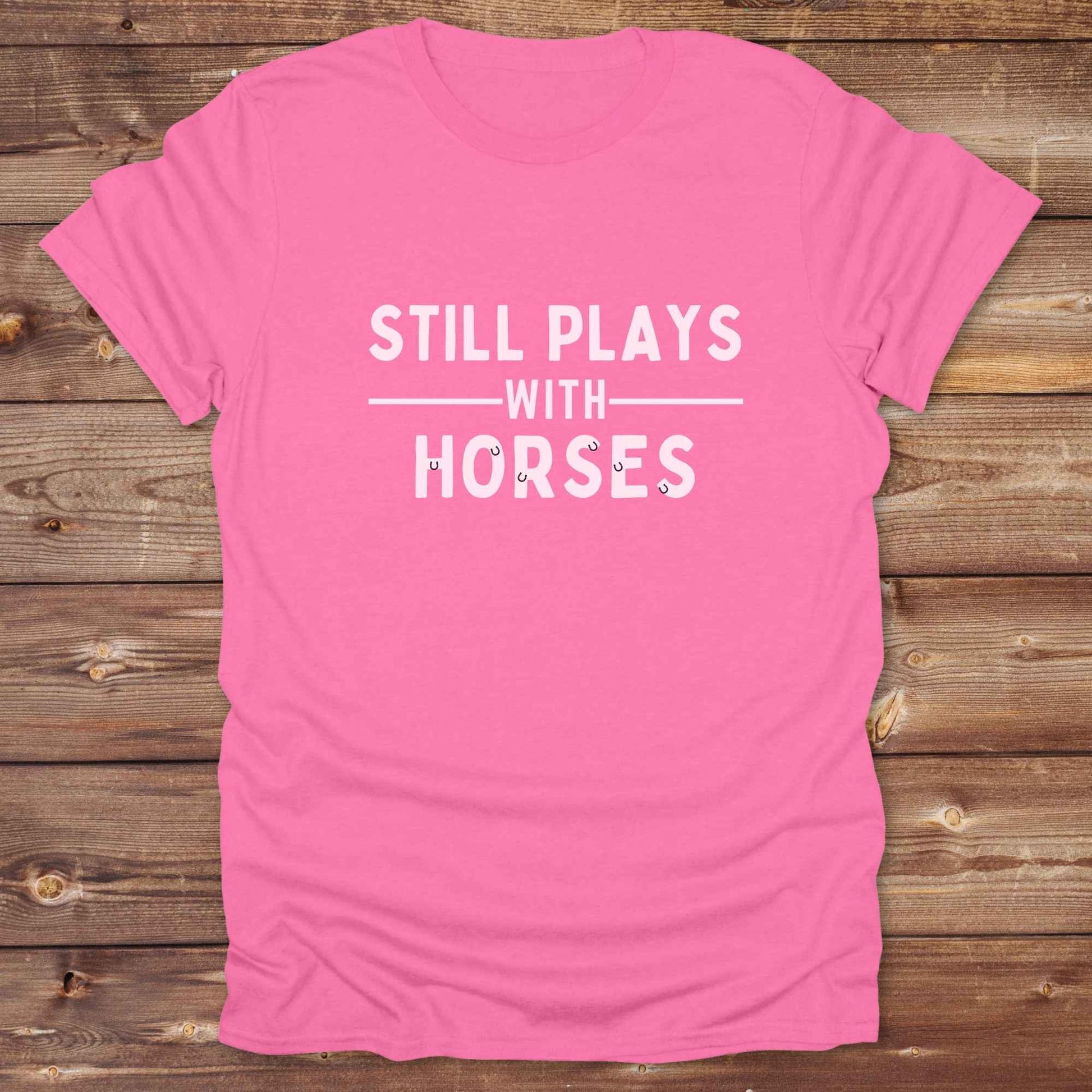 Fun western t-shirt for horse lovers and cowgirls. Western cowgirl graphic tee with horse design. Cowboy humor t-shirt for rodeo and country lovers. Horse lover funny t-shirt with western theme. Country style horse graphic tee for cowboys and cowgirls. Retro style funny western shirt for equestrians. Cute and funny country shirt with horse print. Southern cowgirl funny quote shirt for horse lovers. Still plays with horses.