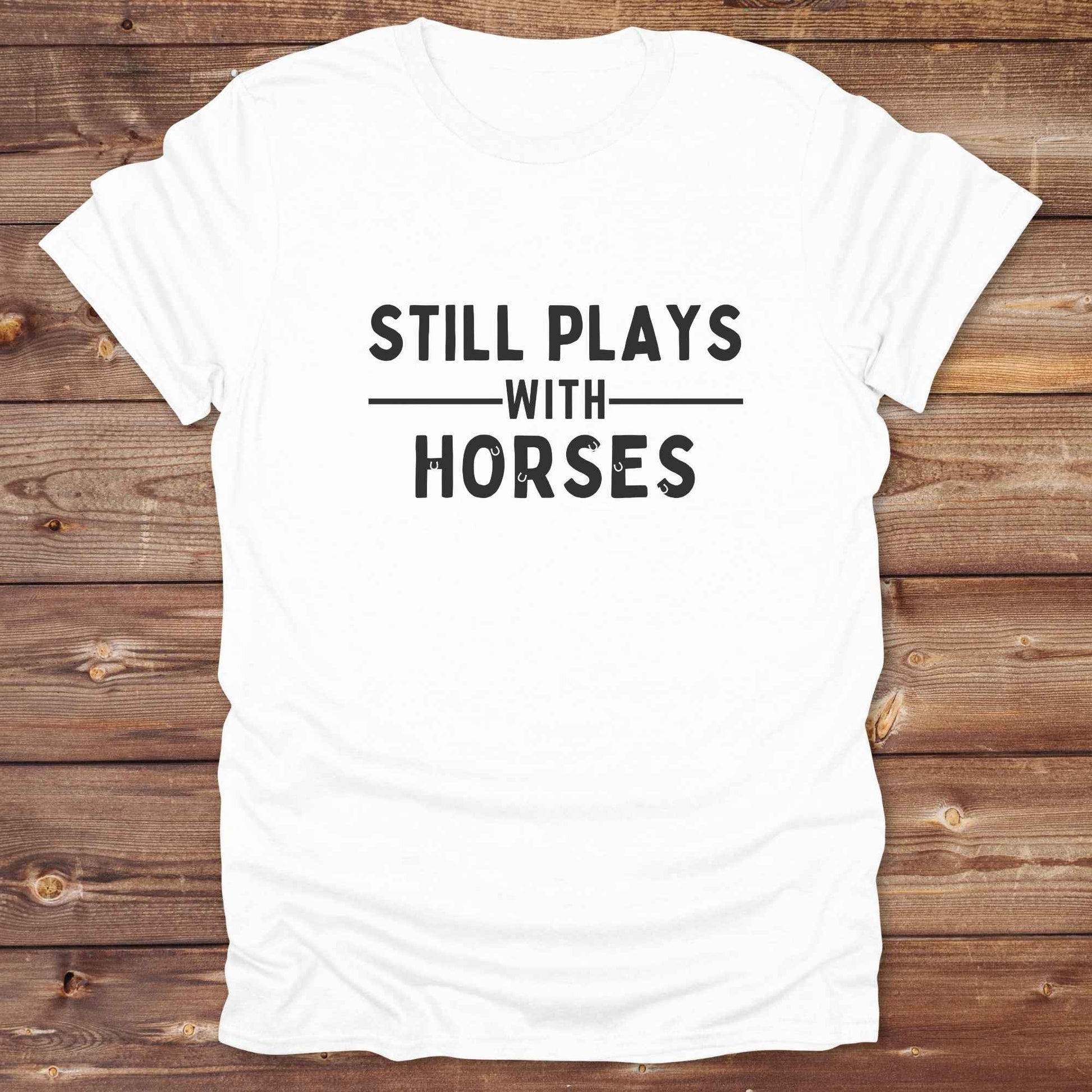 Fun western t-shirt for horse lovers and cowgirls. Western cowgirl graphic tee with horse design. Cowboy humor t-shirt for rodeo and country lovers. Horse lover funny t-shirt with western theme. Country style horse graphic tee for cowboys and cowgirls. Retro style funny western shirt for equestrians. Cute and funny country shirt with horse print. Southern cowgirl funny quote shirt for horse lovers. Still plays with horses.