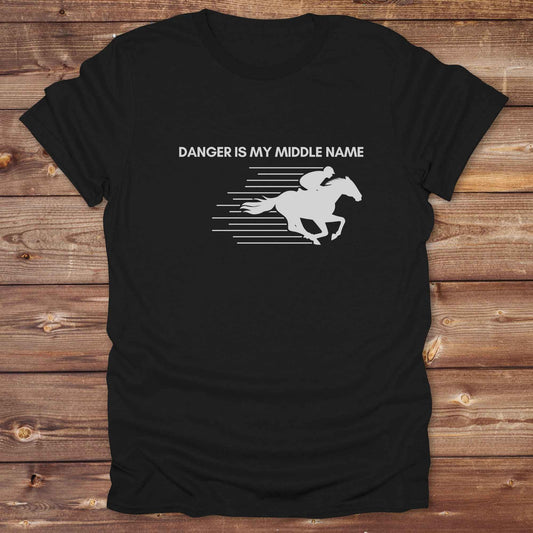 Fun western t-shirt for horse lovers and cowgirls. Western cowgirl graphic tee with horse design. Cowboy humor t-shirt for rodeo and country lovers. Horse lover funny t-shirt with western theme. Country style horse graphic tee for cowboys and cowgirls. Retro style funny western shirt for equestrians. Cute and funny country shirt with horse print. Southern cowgirl funny quote shirt for horse lovers. Danger is my middle name with fast horse.