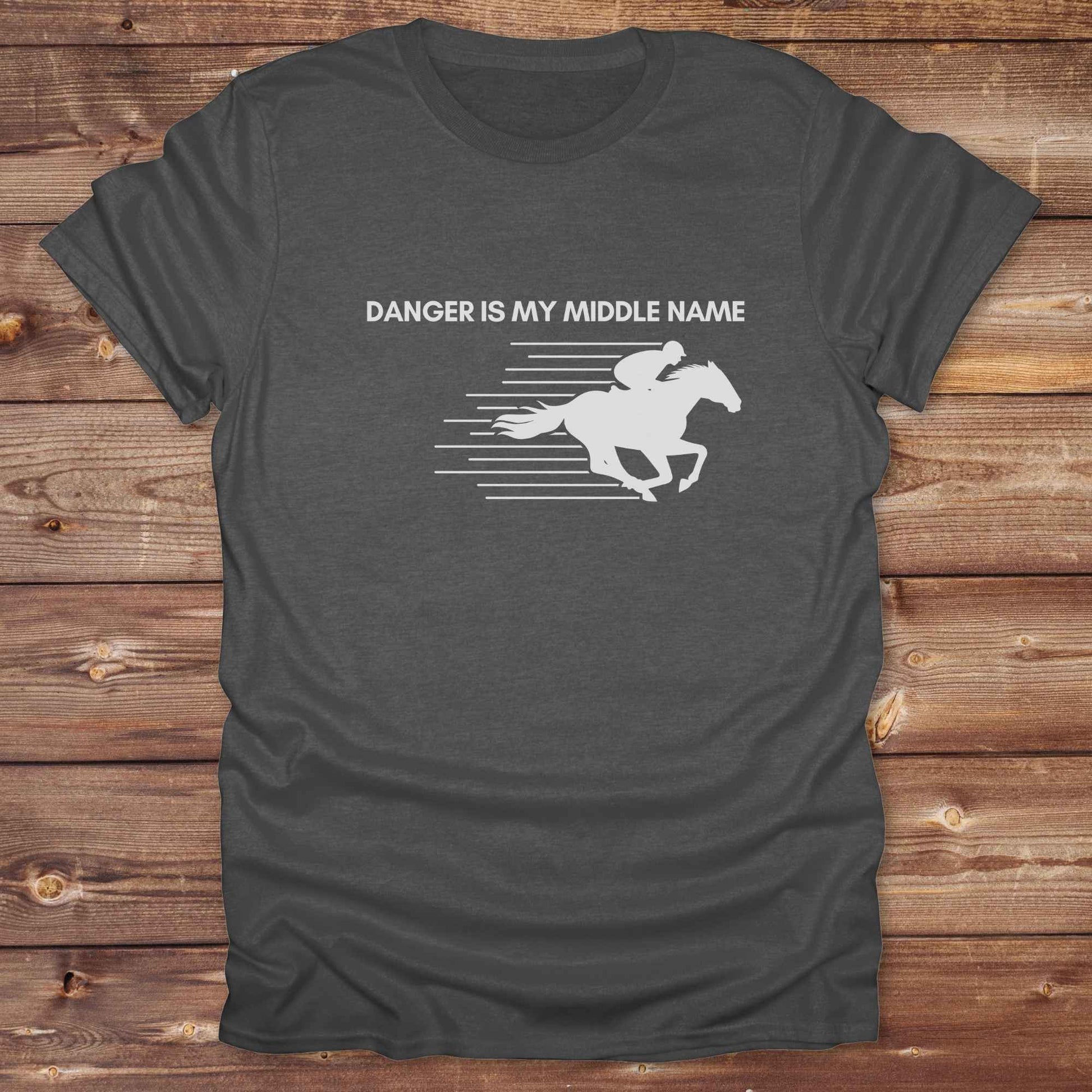 Fun western t-shirt for horse lovers and cowgirls. Western cowgirl graphic tee with horse design. Cowboy humor t-shirt for rodeo and country lovers. Horse lover funny t-shirt with western theme. Country style horse graphic tee for cowboys and cowgirls. Retro style funny western shirt for equestrians. Cute and funny country shirt with horse print. Southern cowgirl funny quote shirt for horse lovers. Danger is my middle name with fast horse.