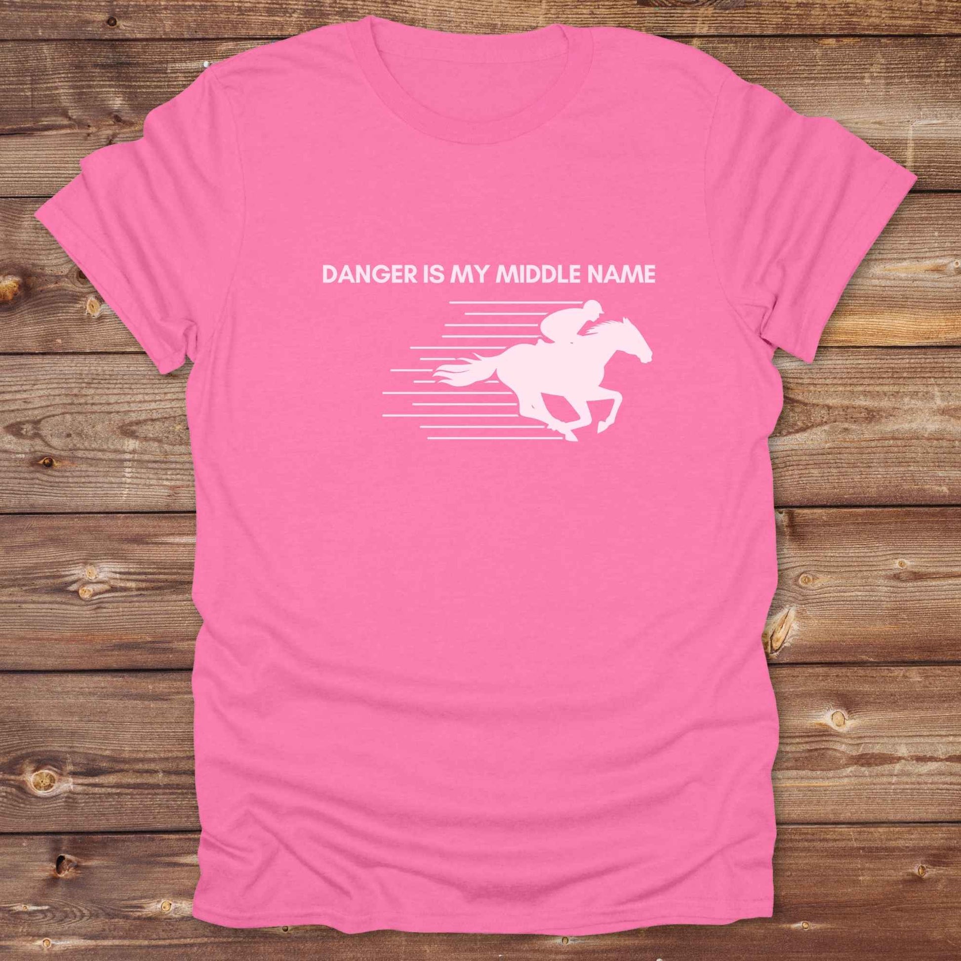 Fun western t-shirt for horse lovers and cowgirls. Western cowgirl graphic tee with horse design. Cowboy humor t-shirt for rodeo and country lovers. Horse lover funny t-shirt with western theme. Country style horse graphic tee for cowboys and cowgirls. Retro style funny western shirt for equestrians. Cute and funny country shirt with horse print. Southern cowgirl funny quote shirt for horse lovers. Danger is my middle name with fast horse.