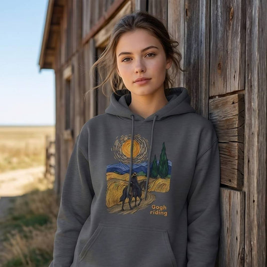 Woman wearing a hoodie with a Van Gogh design leaning against a wooden barn. Gogh riding horse girl hoodie, horse mom hoodie, horse lover, horse girl, Funny horse lover gifts, Funny horse hoodies, Horse girl gifts, Equestrian graphic hoodies, fathers day gift, Sarcastic horse hoodie